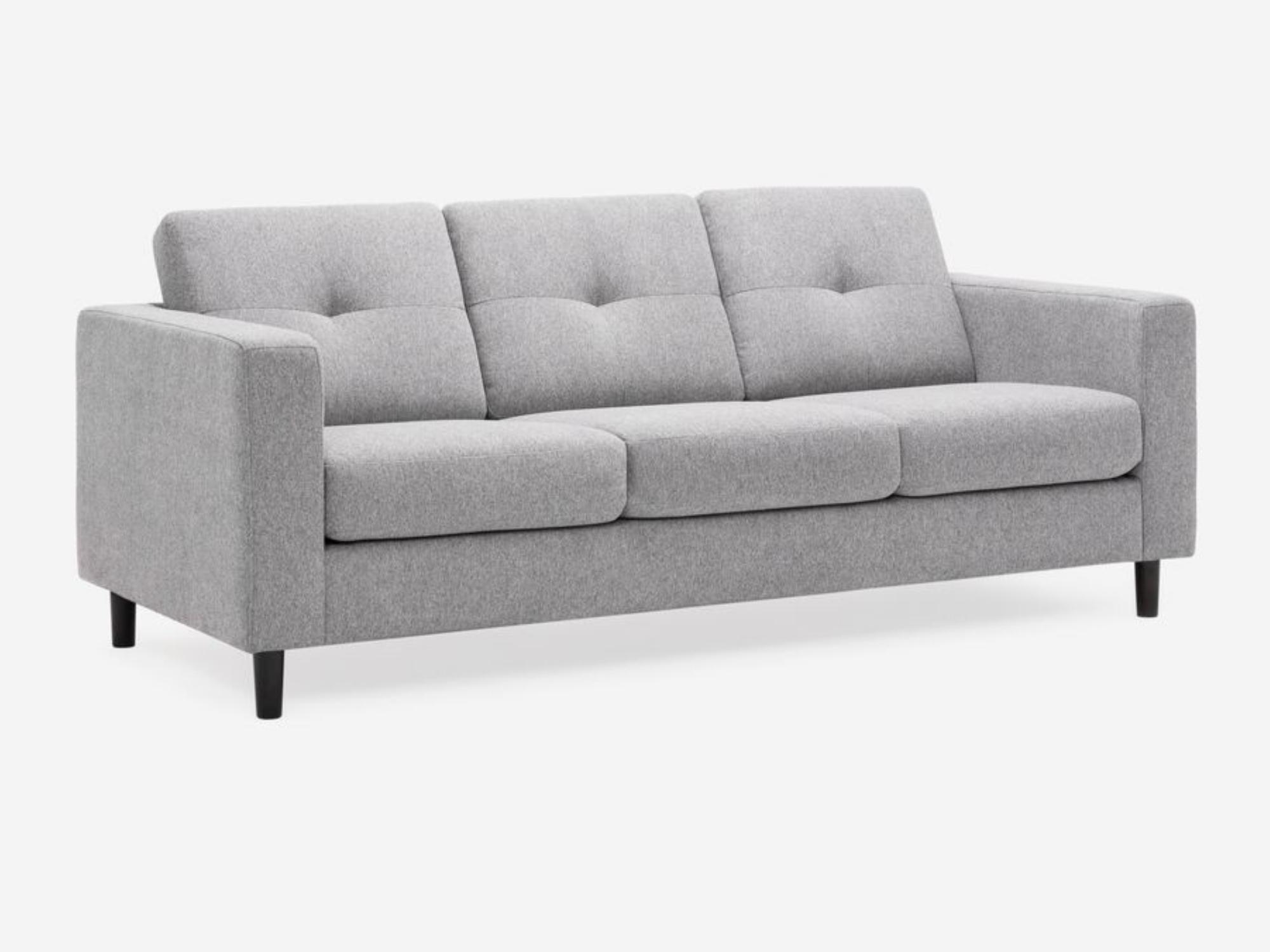 Angled view of the Solo modern couch in grey fabric