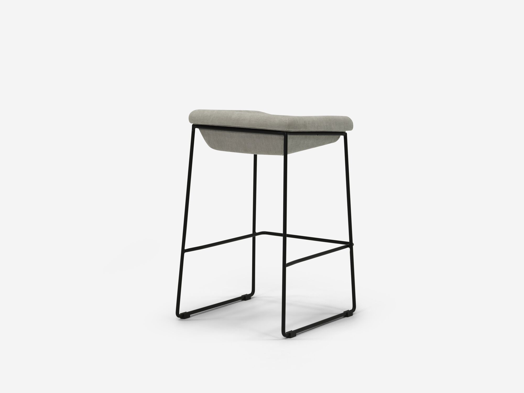 Counter stool with grey seat and black legs back angle view