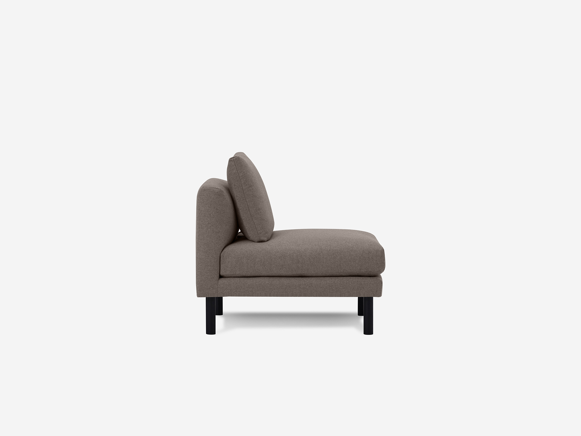 Side view of dark grey armless chair with cushion