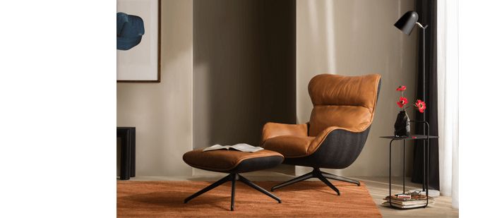 Leather chair is displayed in a living room