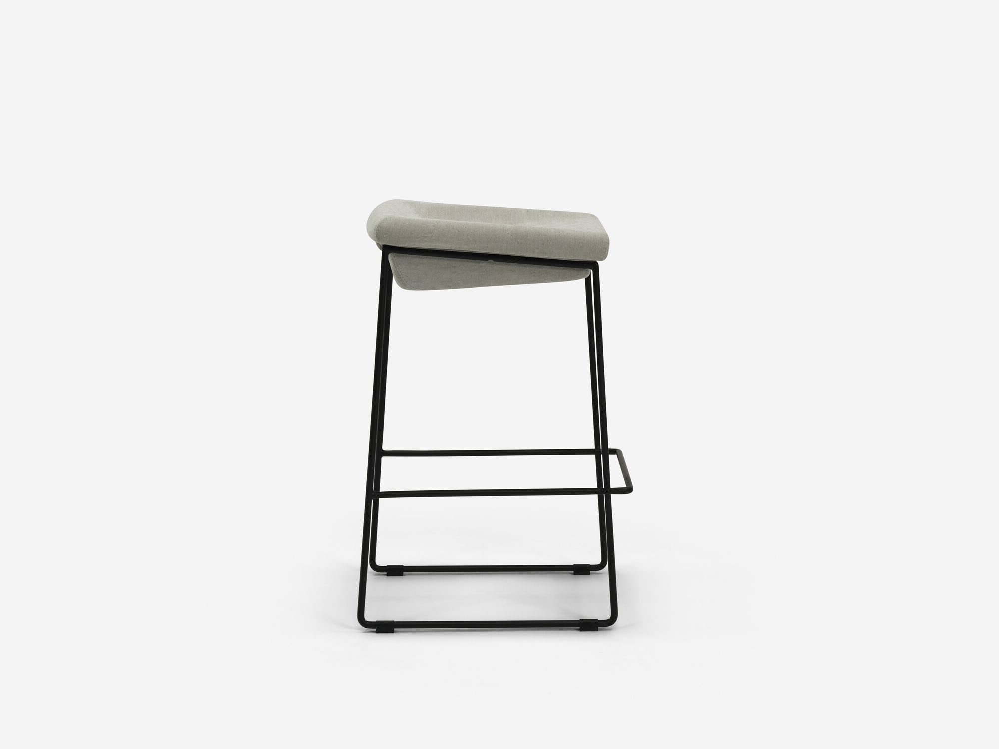 Side view of counter stool with grey seat and black legs