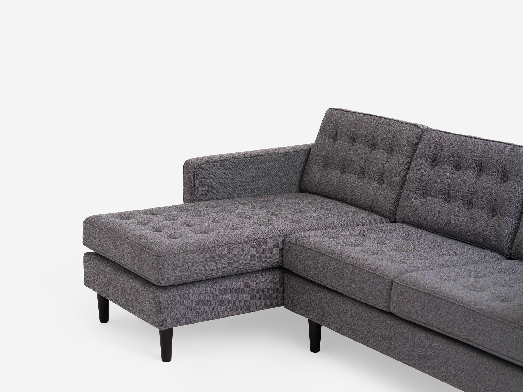 Detail view of the  Reverie modern sectional sleeper sofa in grey fabric with left hand facing chaise