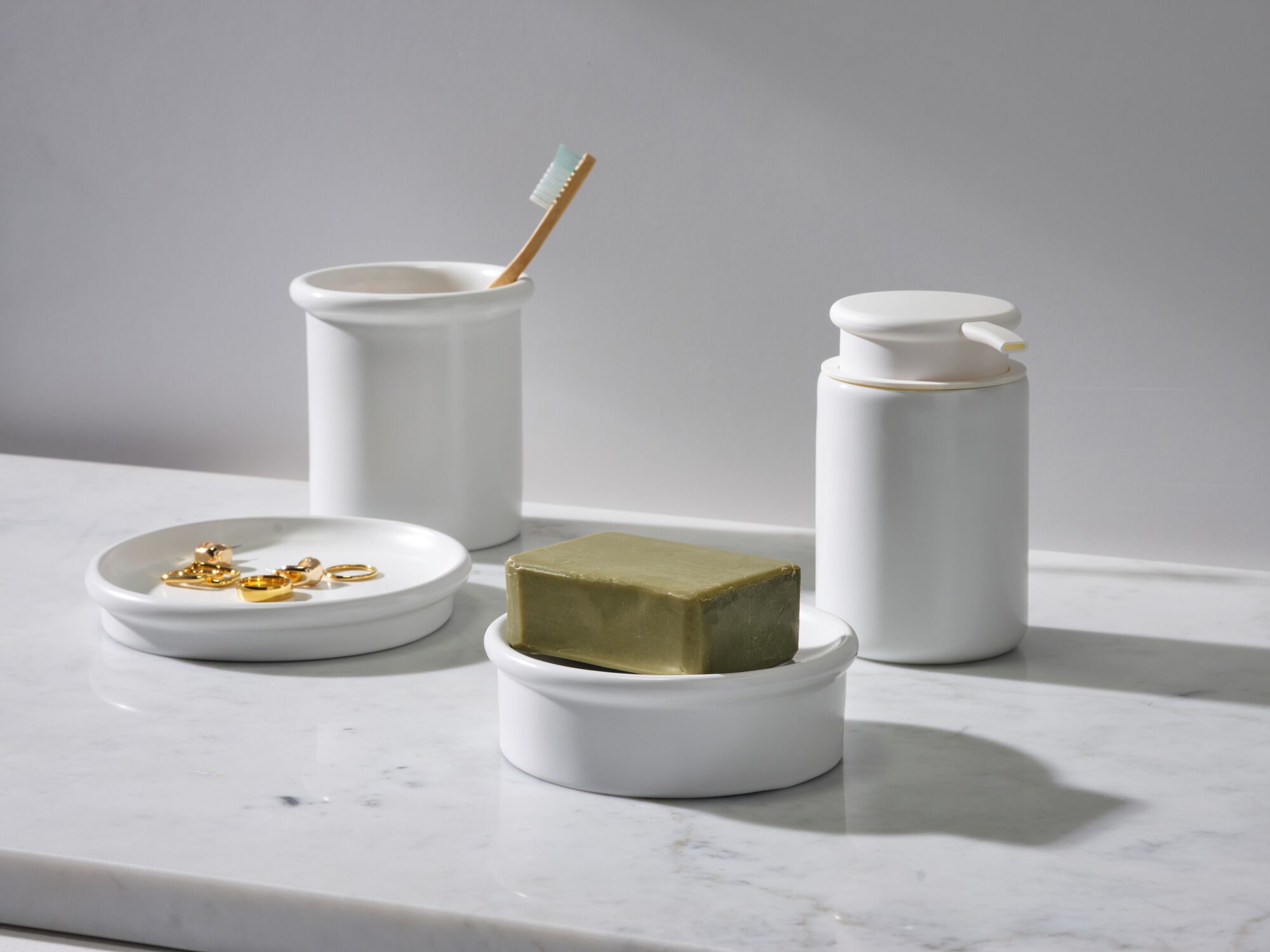 White porcelain toothbrush holder and bath accessories