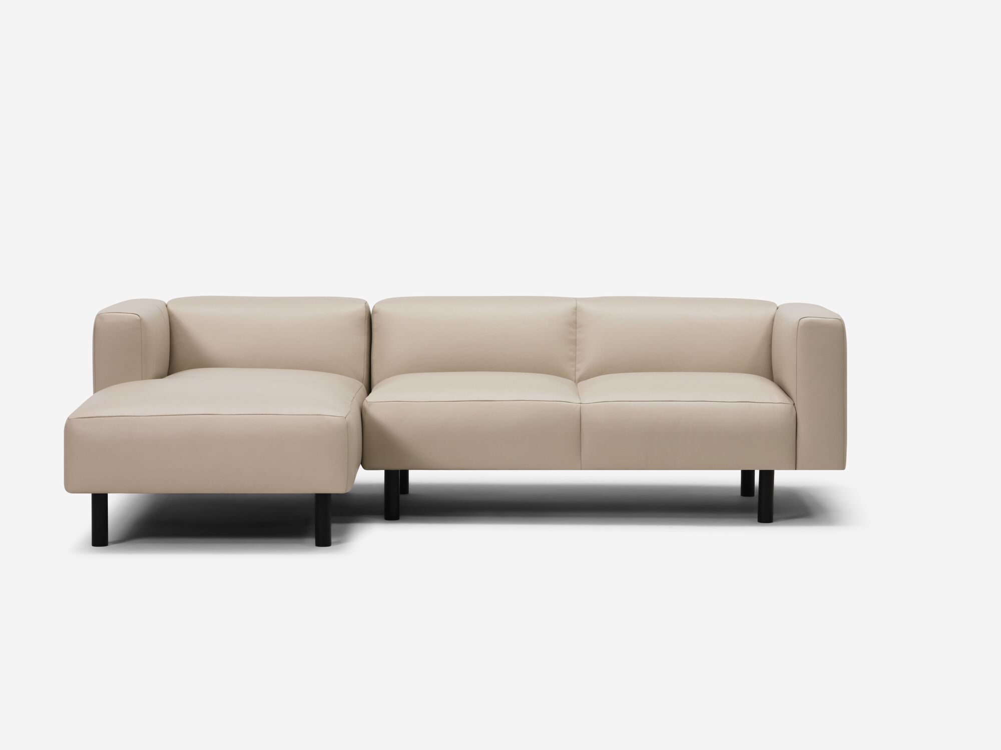 Front view of beige leather sectional with left chaise