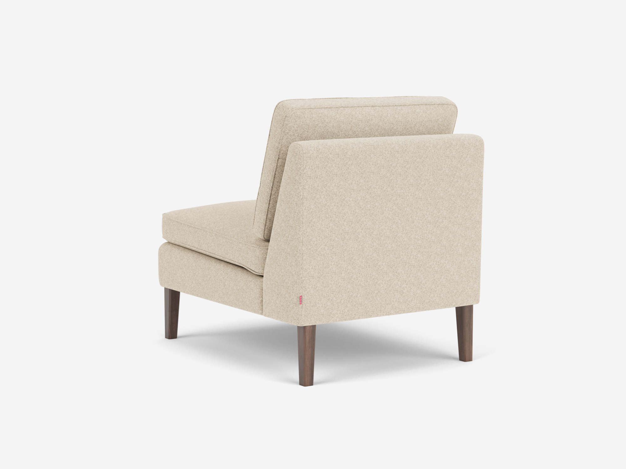 Back angled view of the Skye mid century modern armless chair in beige fabric