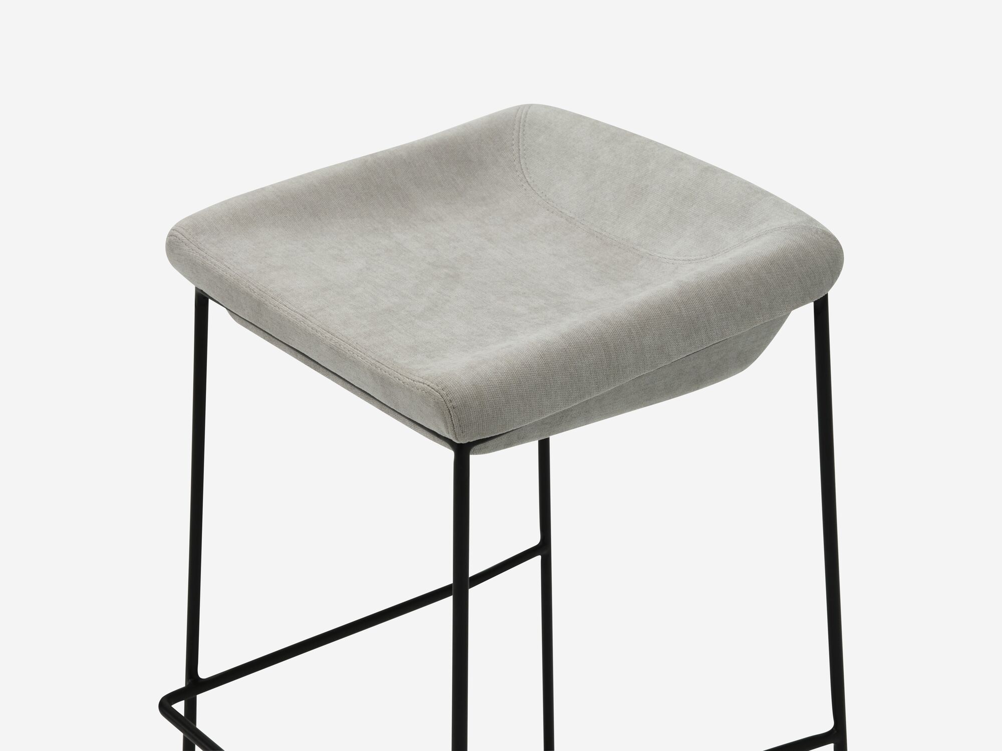 Counter stool with grey seat and black legs detail view