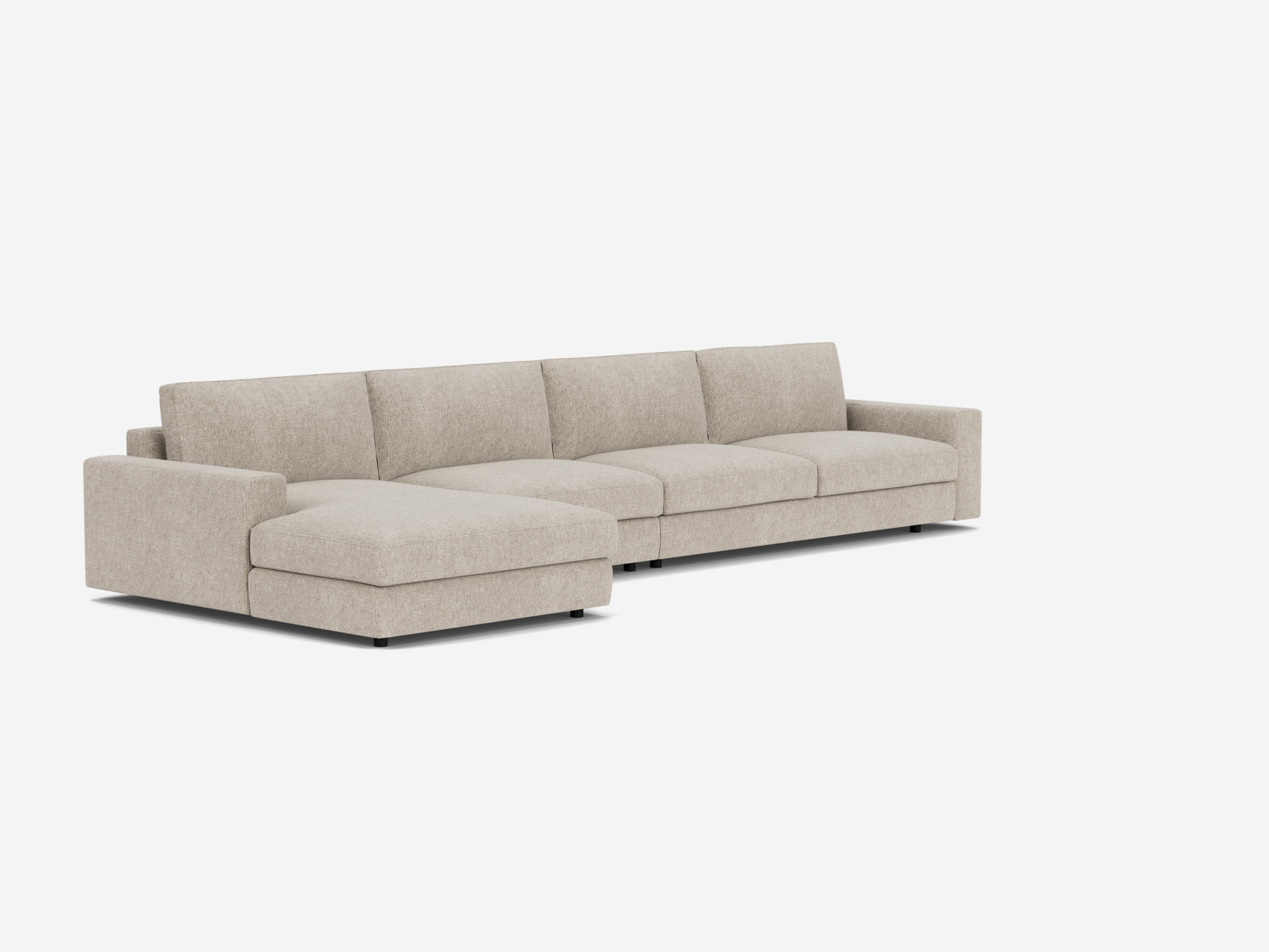 Corner view of the modular sofa in light grey fabric with left hand chaise