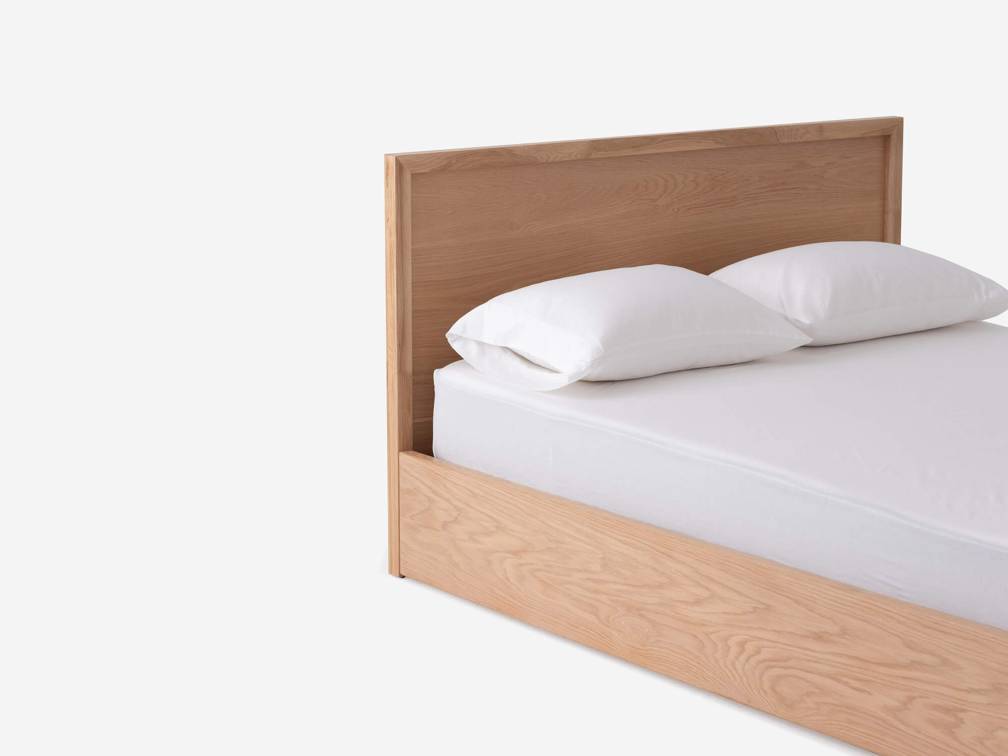 Detail corner view of Marcel lift up storage bed in oak