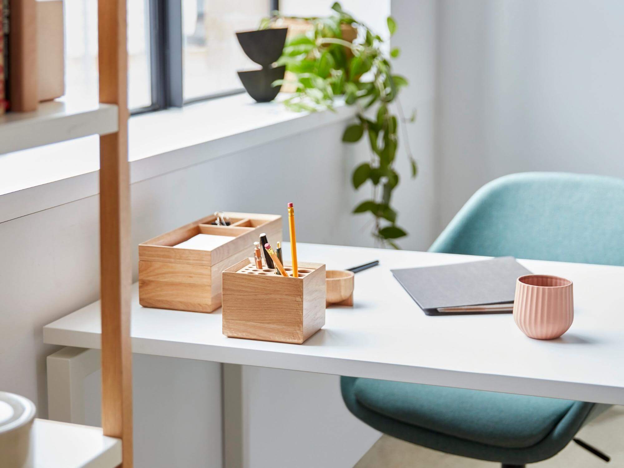 Oak pencil cup on white desk in modern home office