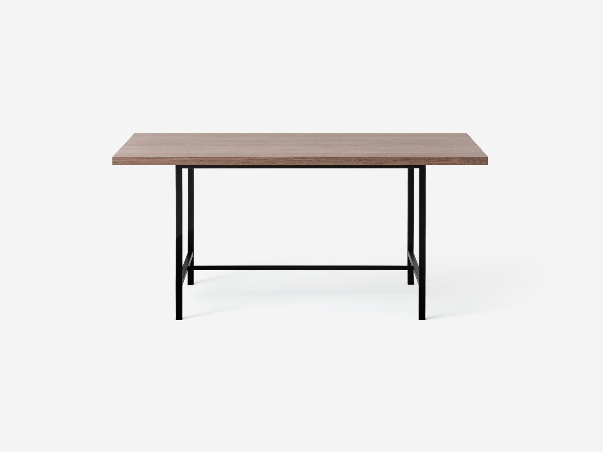 Front view of the Kendall 66" modern dining table with solid walnut top and black base