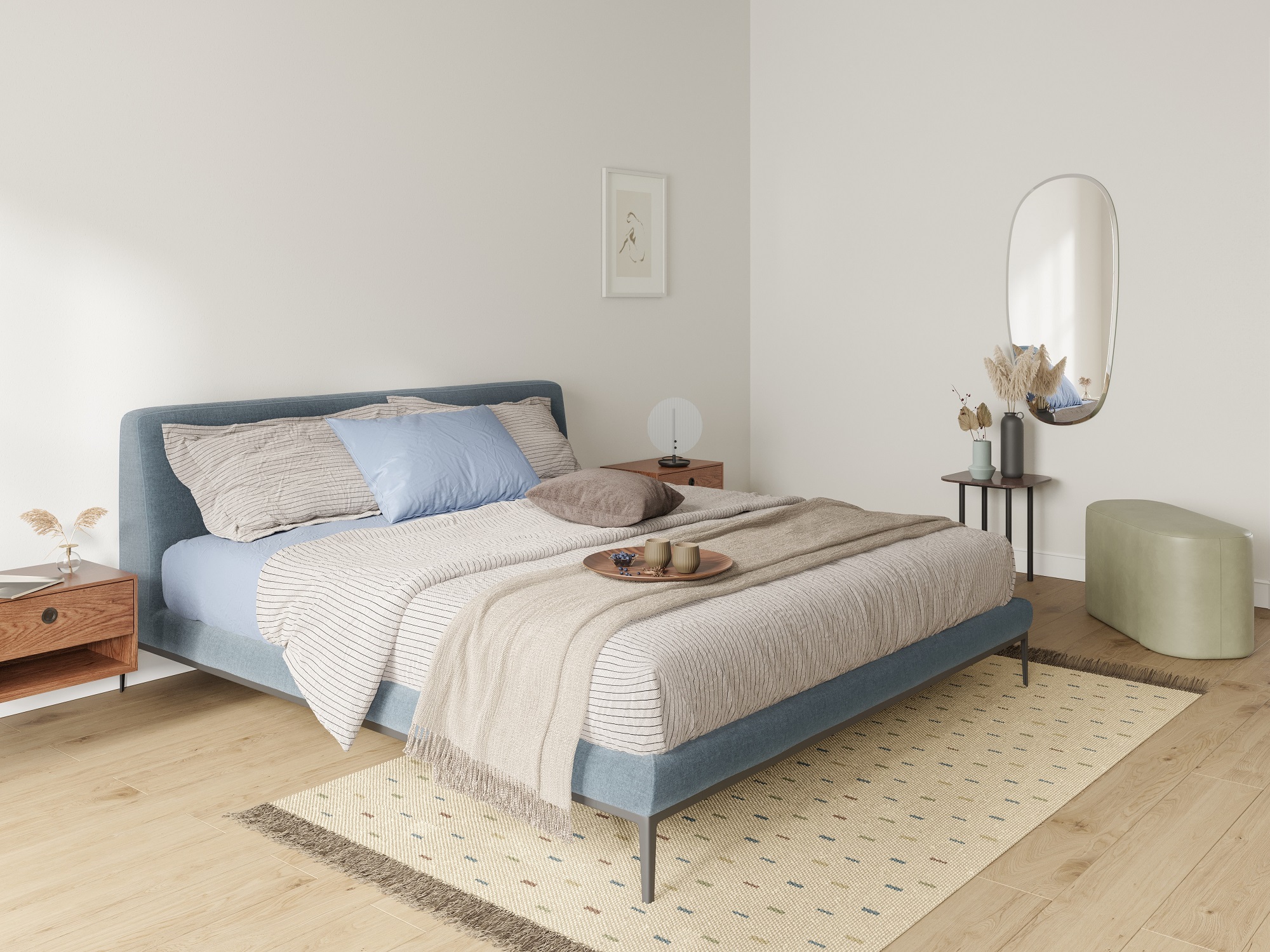 A large oval mirror is displayed on the back wall of a bedroom