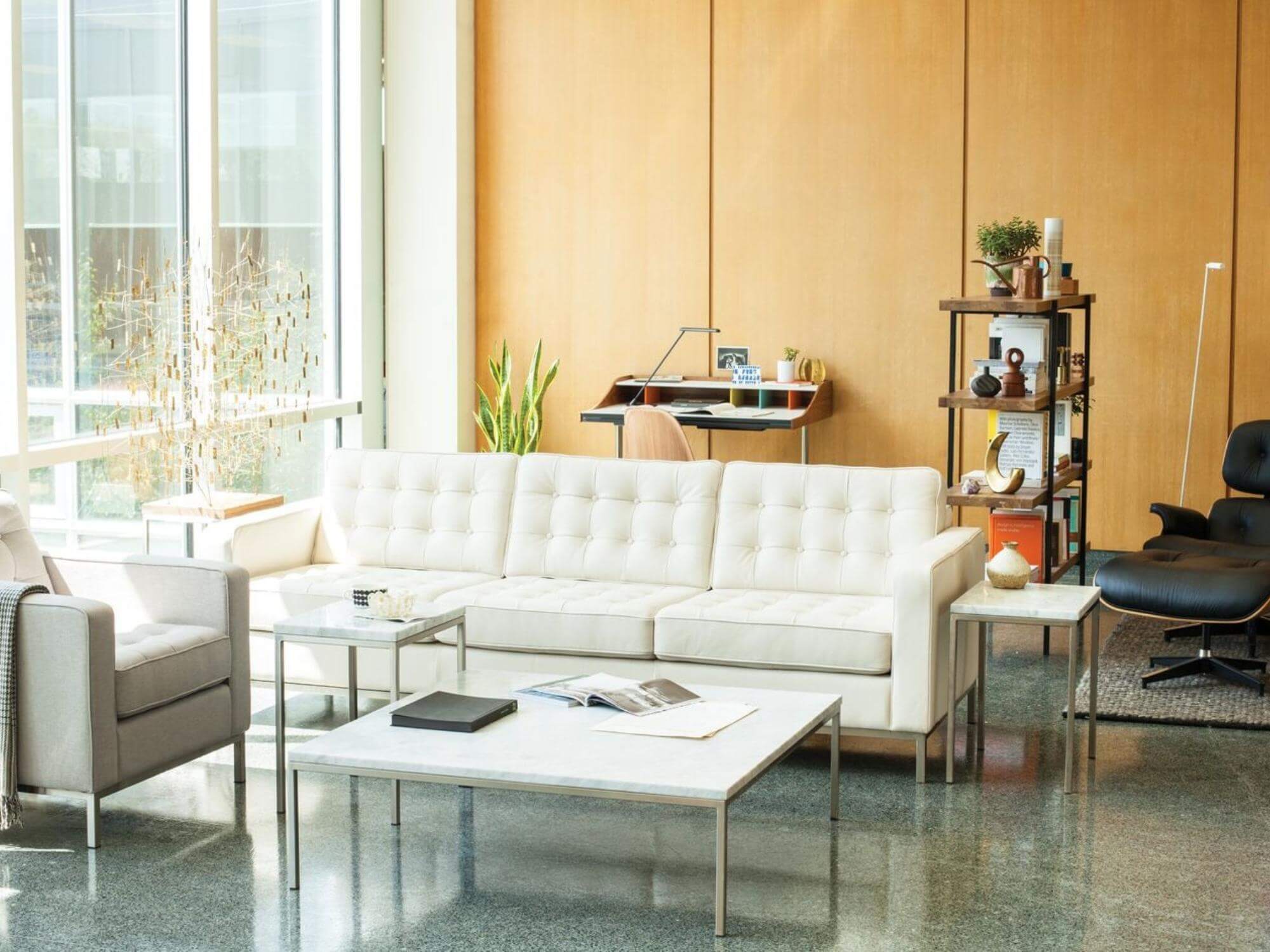 Iconic mid century desk behind couch in modern living room