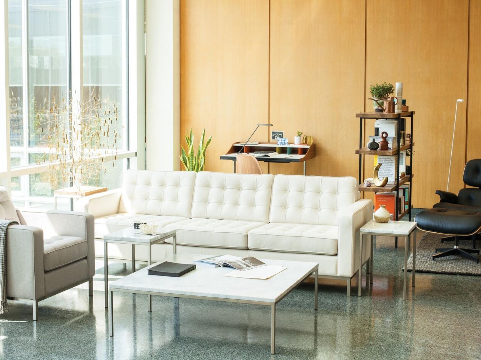 Iconic mid century desk behind couch in modern living room