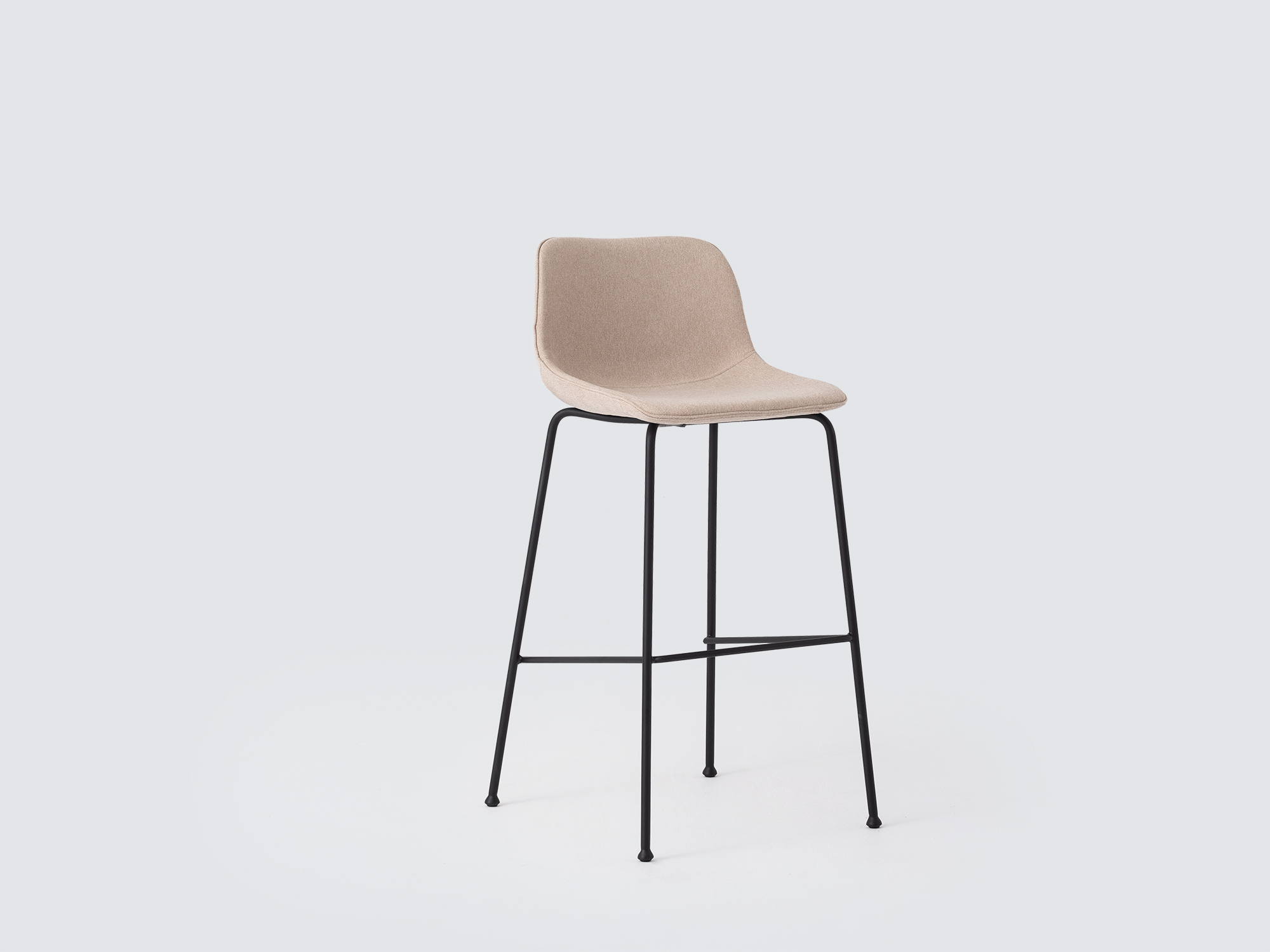 Angled view of the Oles counter height bat stool with beige fabric seat