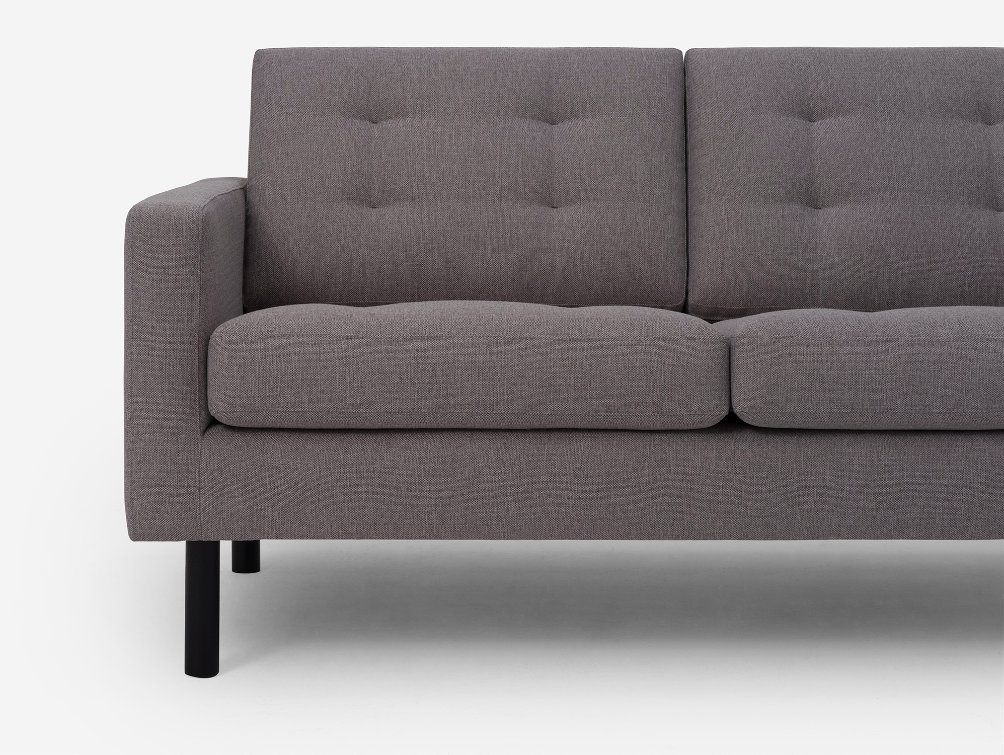 Seat detail view of the Joan loveseat in grey fabric