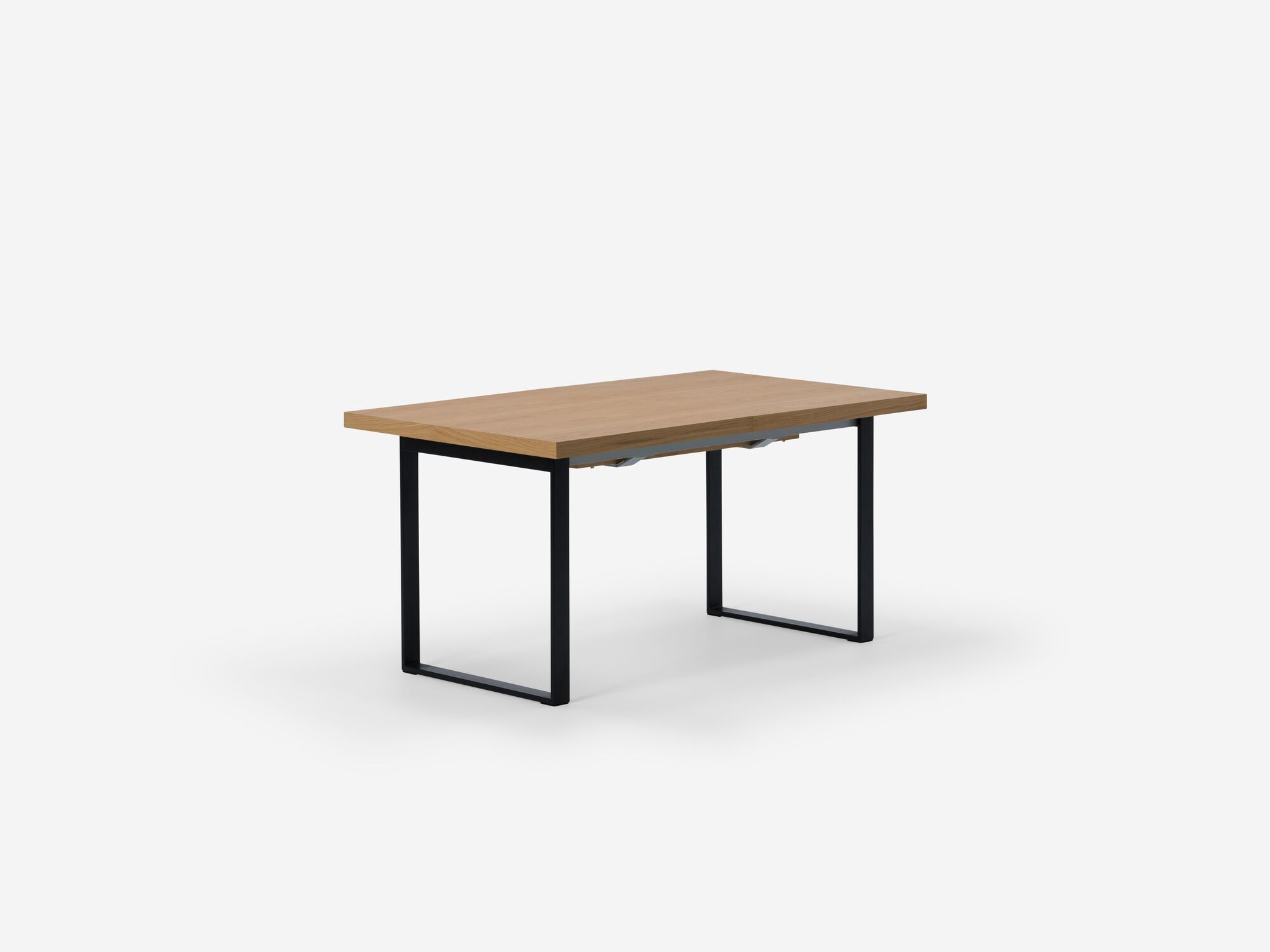 Corner view of expandable dining table with black legs and oak top