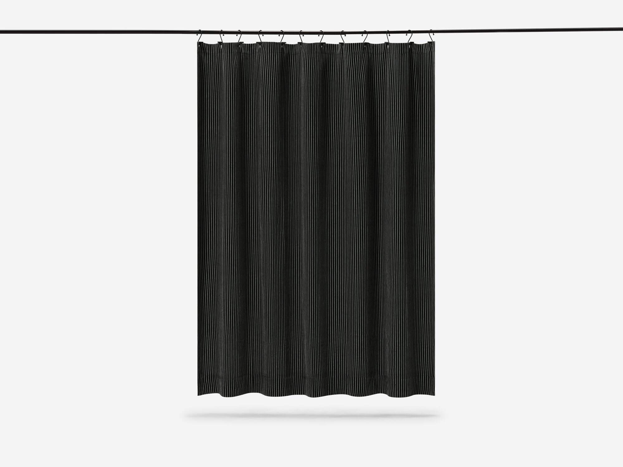 Front view of black and white striped shower curtain