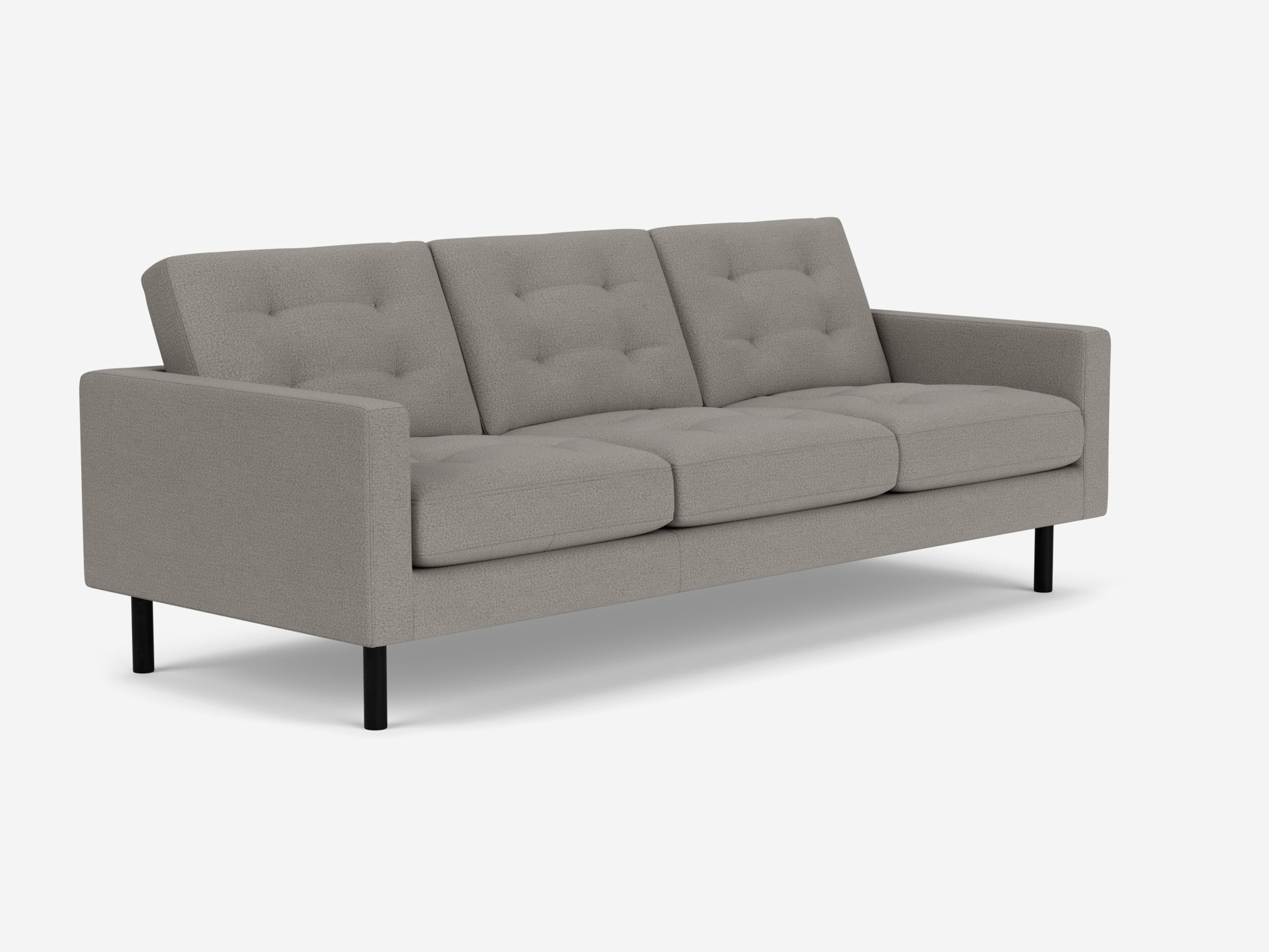 Front angled view of grey tufted couch