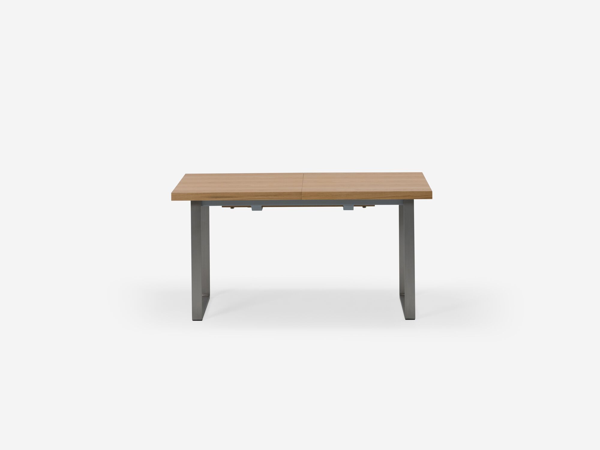 Expandable dining table with stainless steel legs and oak top side view