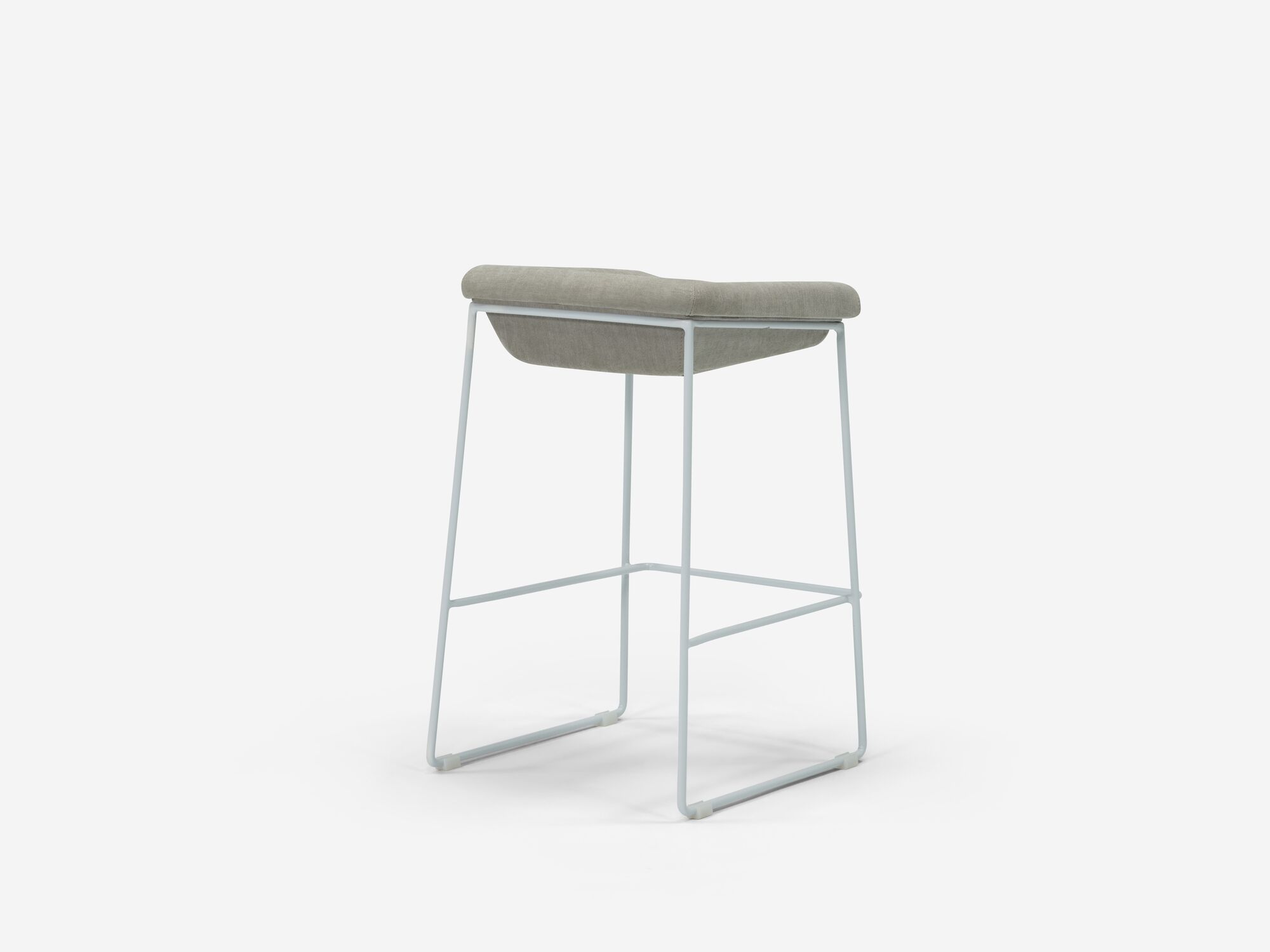 Counter stool with grey seat and white legs back angle view