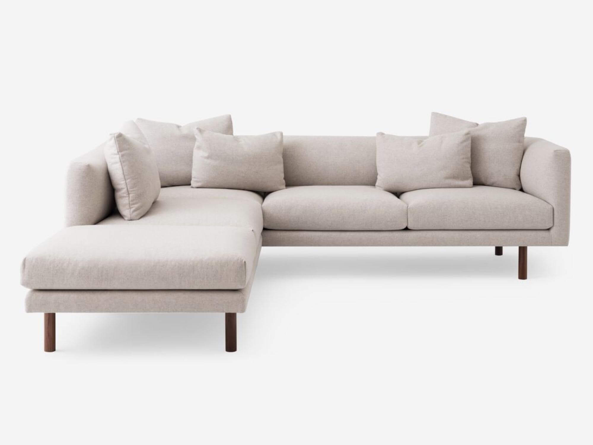 Front view of the Replay modern sectional upholstered in beige fabric