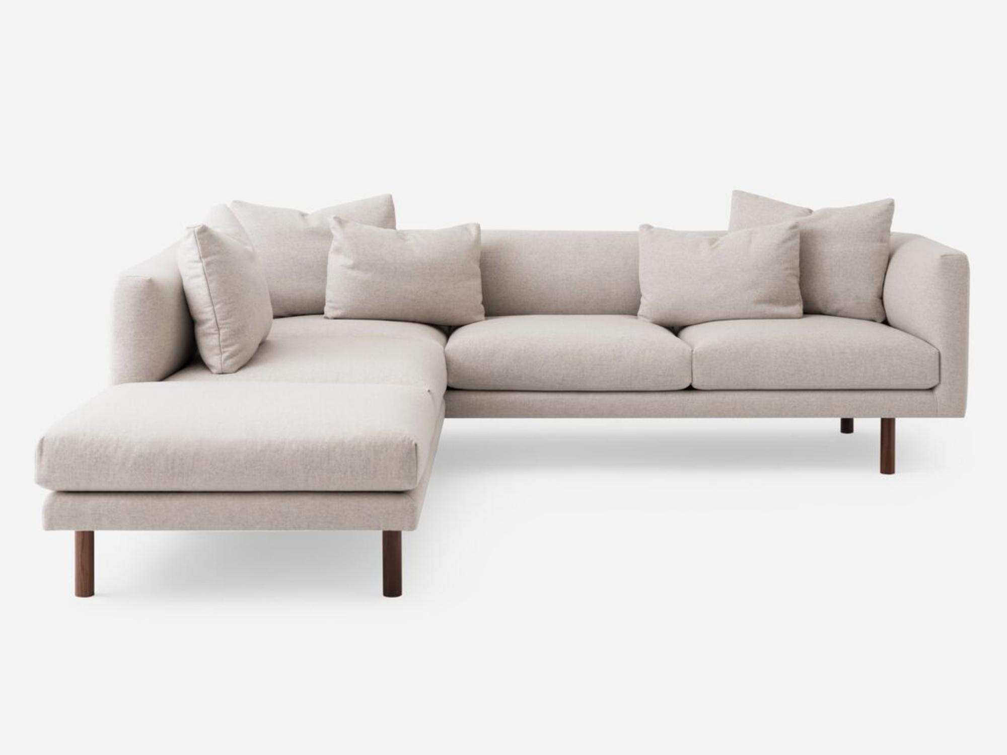 Front view of the Replay modern sectional upholstered in beige fabric