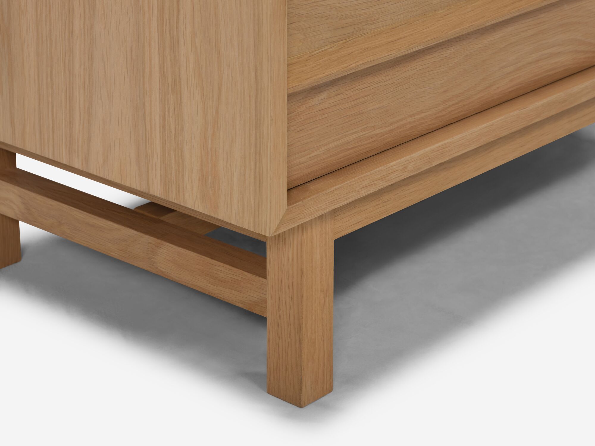 detail leg view of the Marcel mid century dresser in oak
