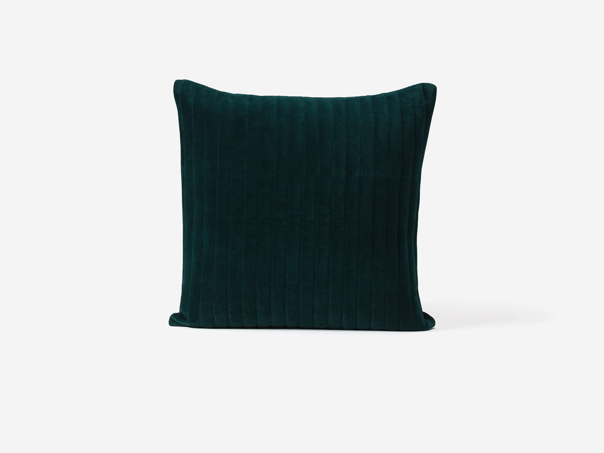 Green velvet accent pillow side view