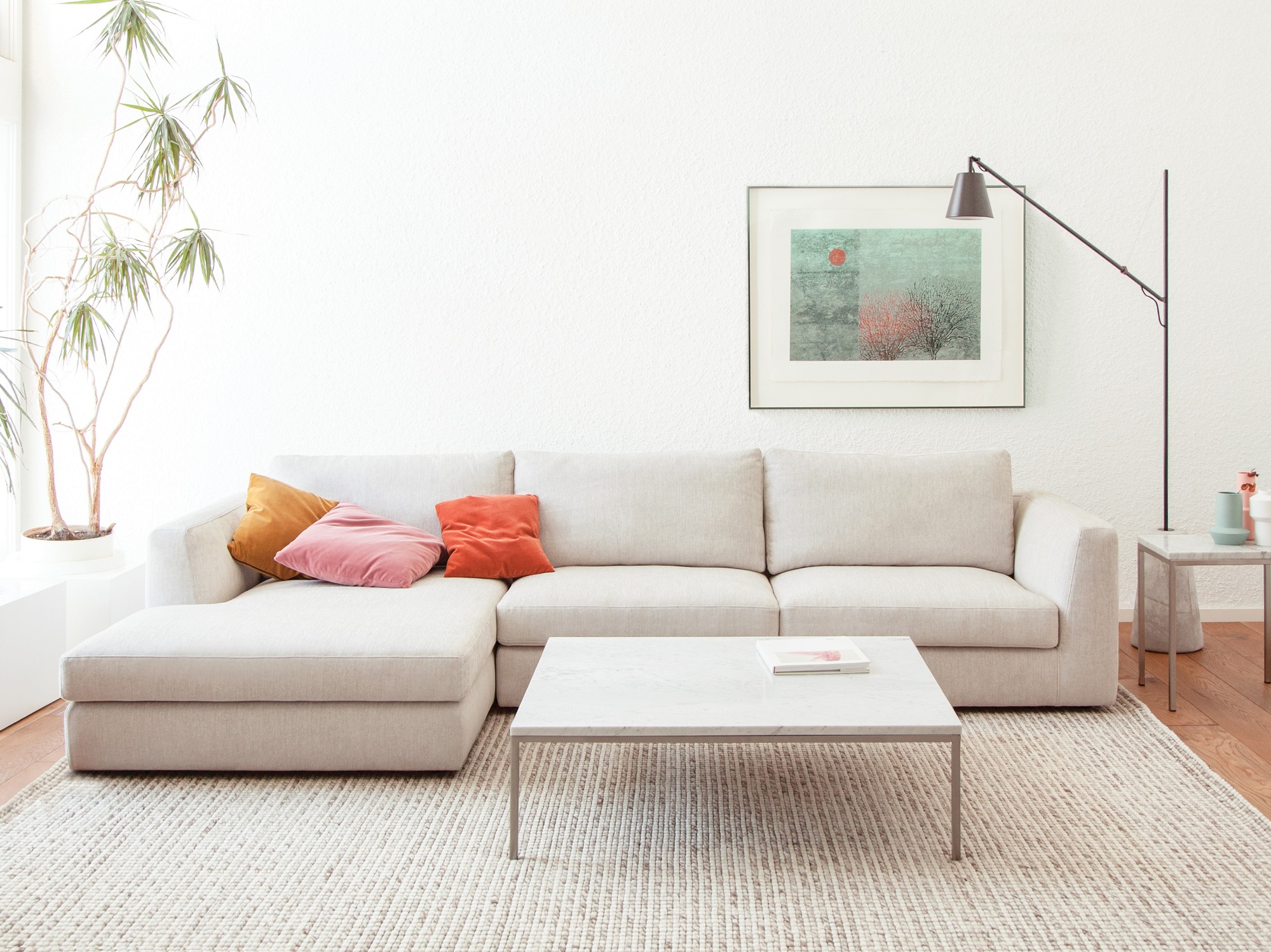 Stainless steel and white marble coffee table in contemporary living room