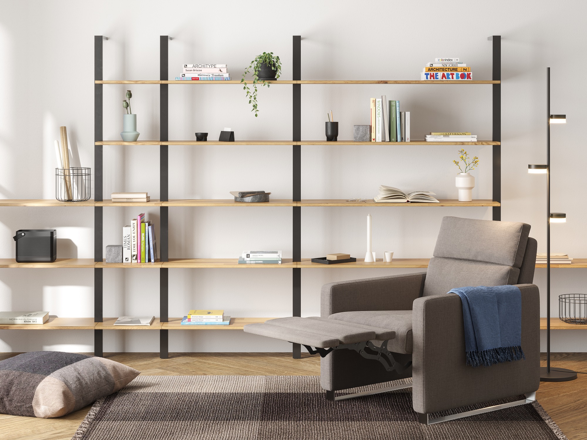 Grey reclining chair in front of open bookcase in reading room