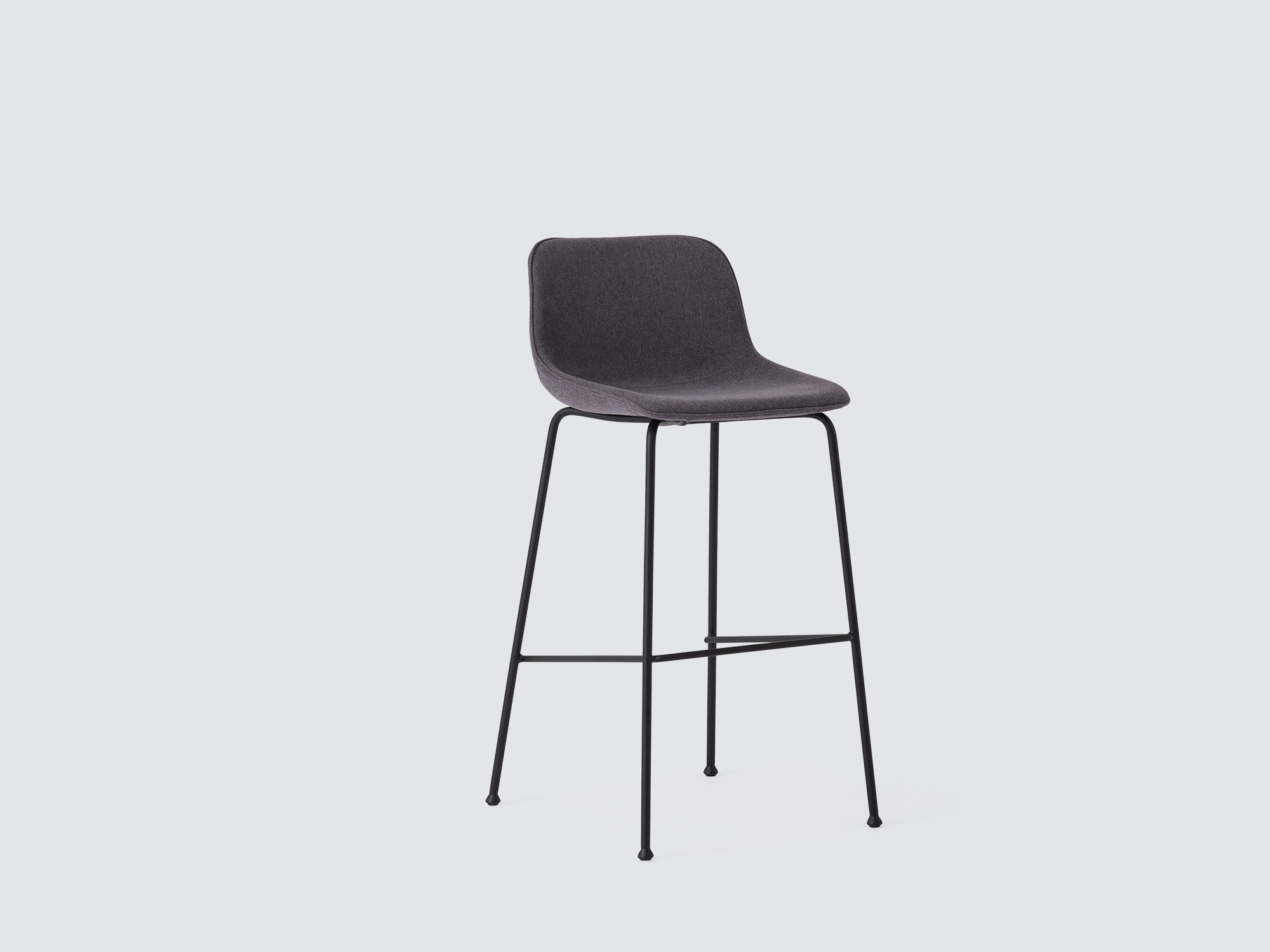 Angled view of the Oles counter height bat stool with grey fabric seat