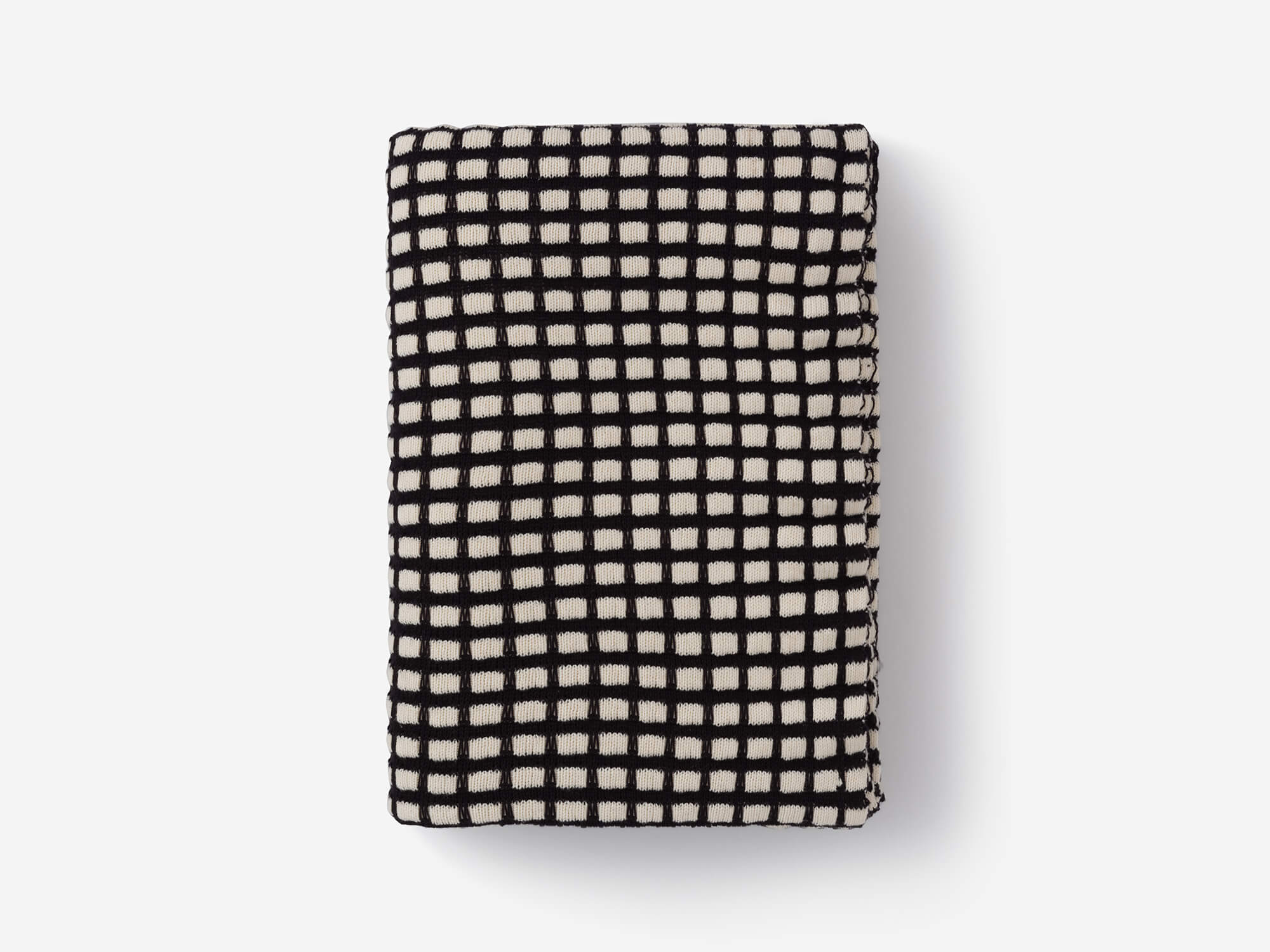 Top view of folded check pattern throw blanket