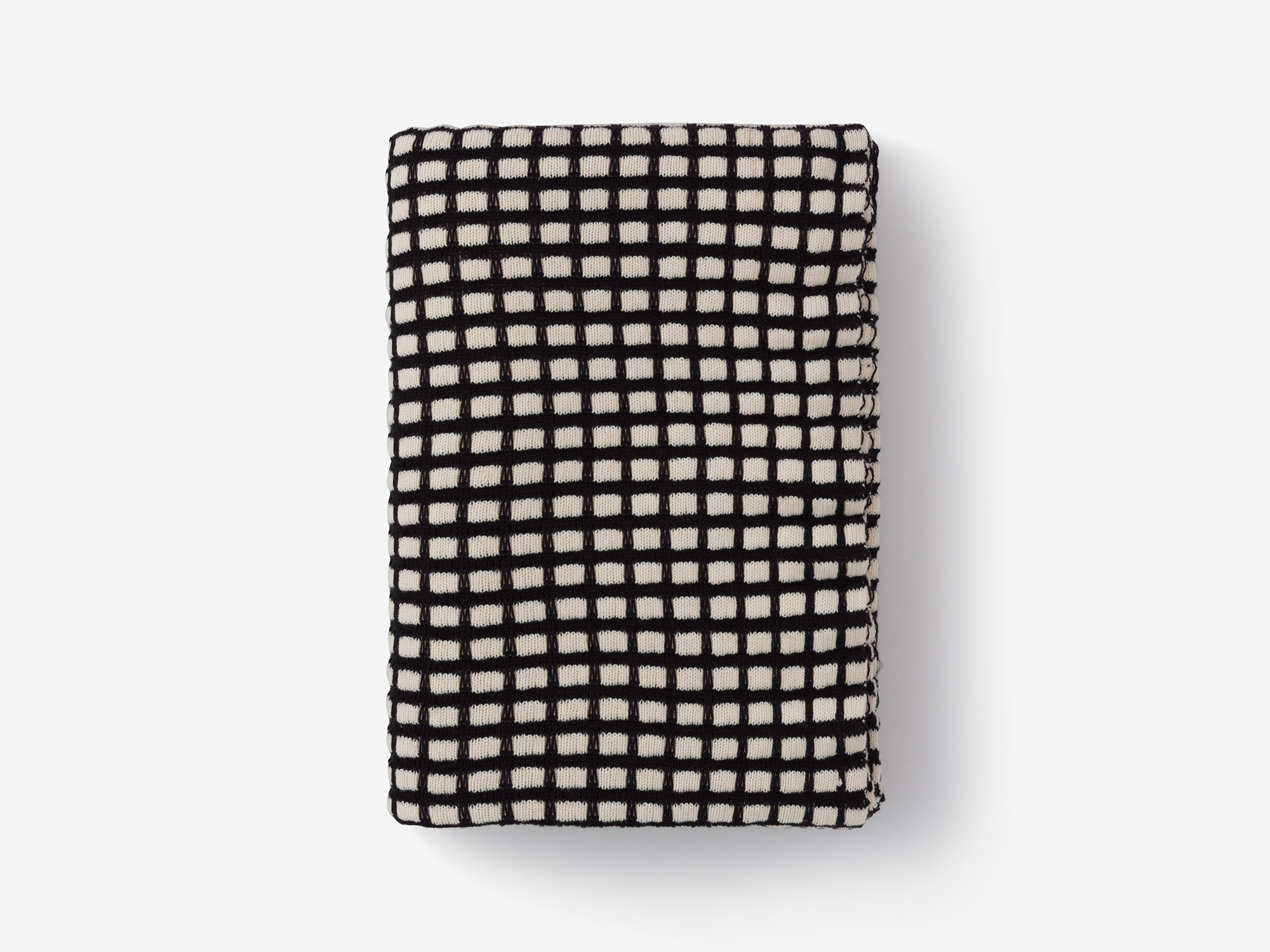 Top view of folded check pattern throw blanket