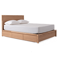 Front angle view of oak storage bed