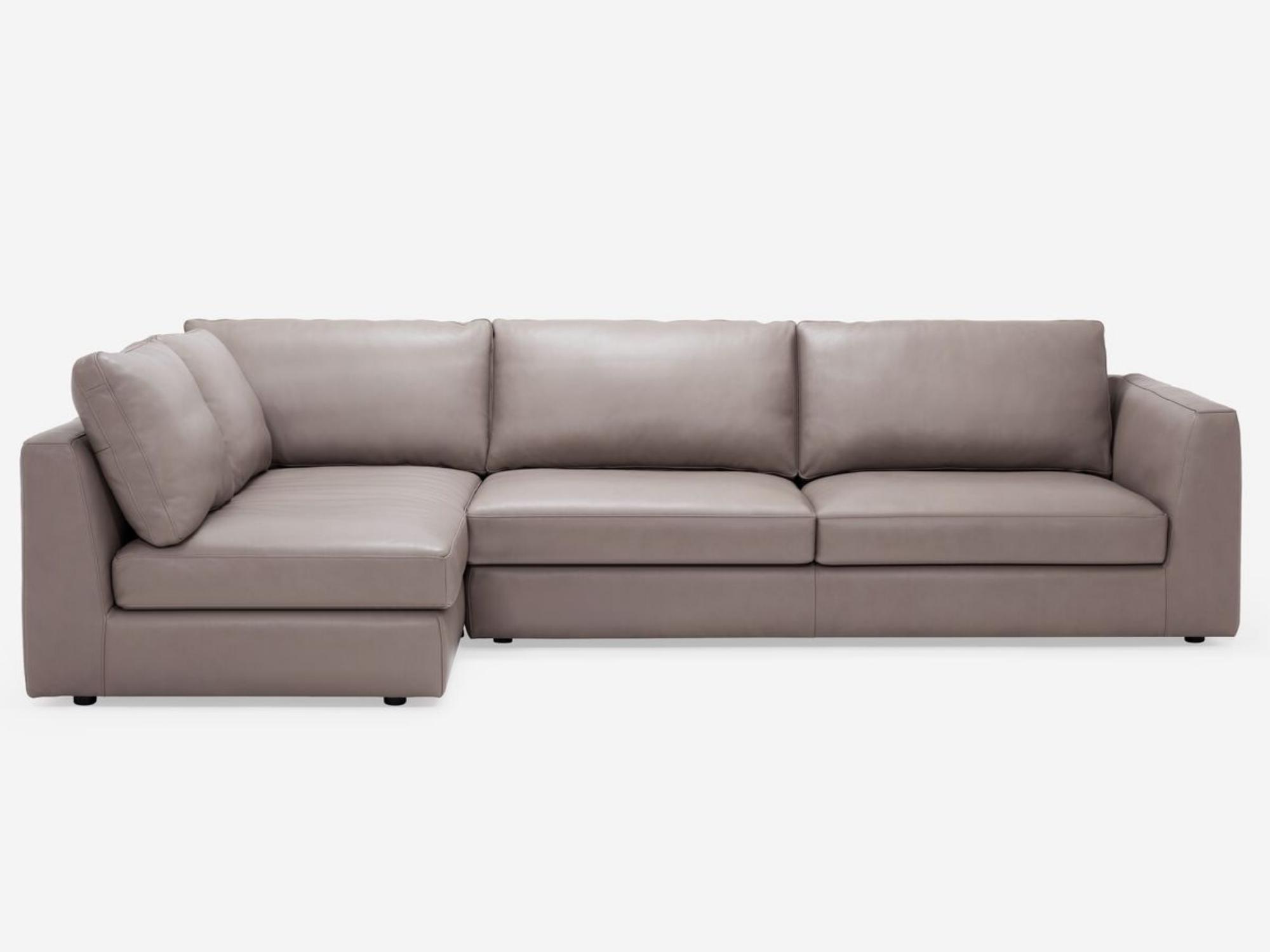 Front view of the Cello modular sofa in beige leather with left hand chaise