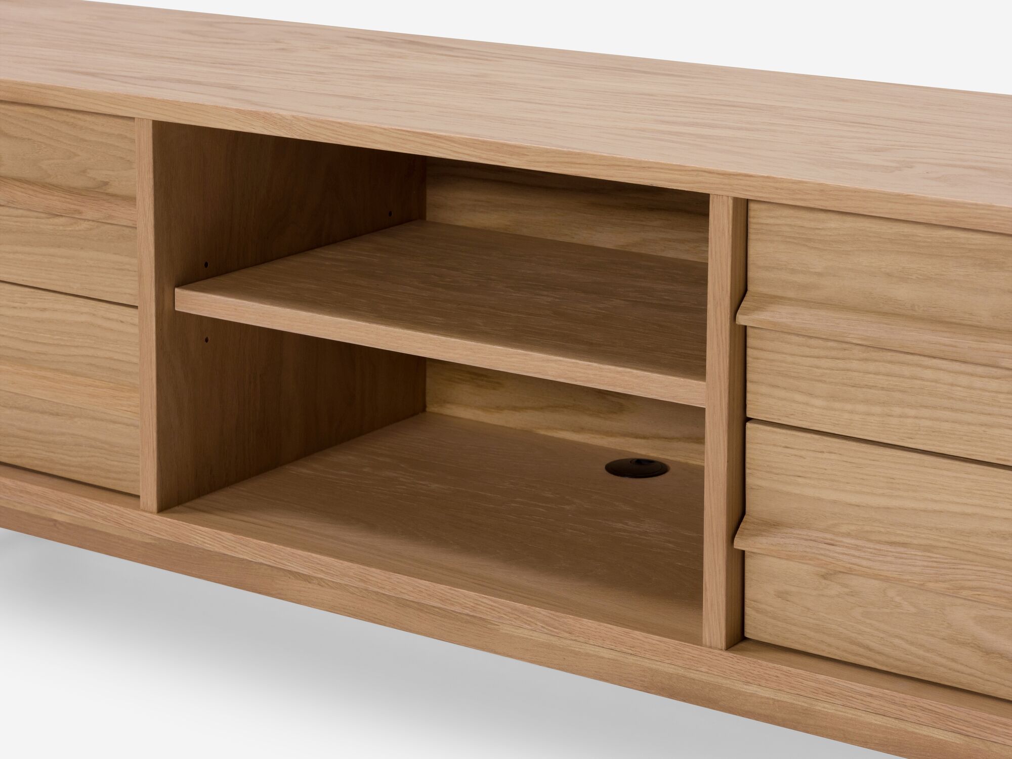 Detail view of small oak media unit open shelf