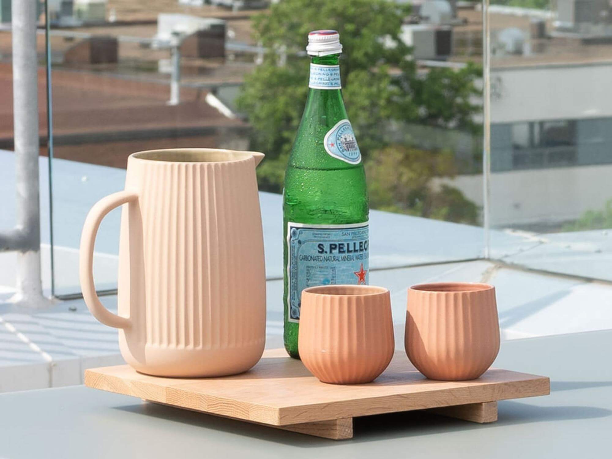 Blush stoneware jug with beige table runner on beige dining room table