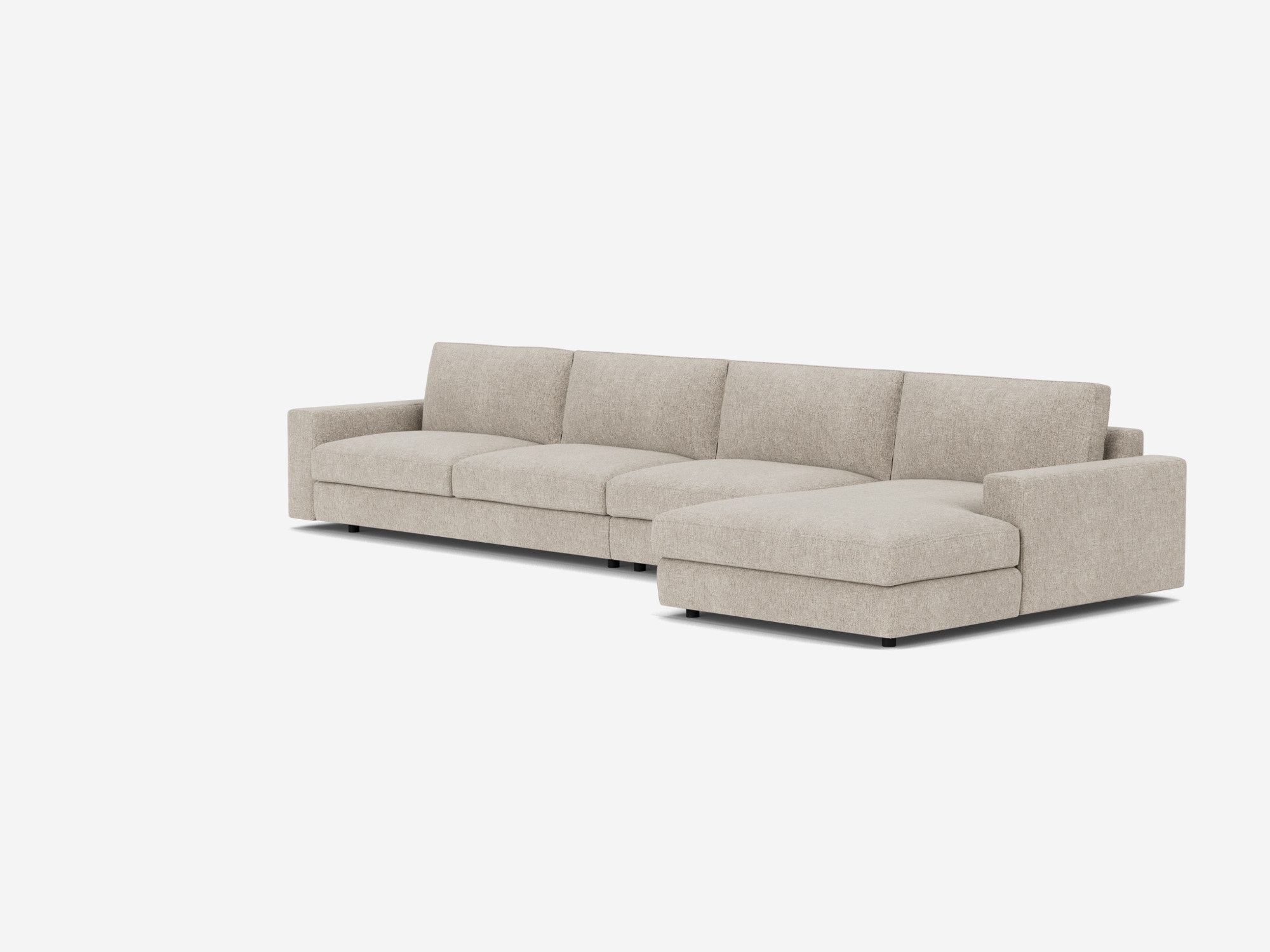 Corner view of the modular sofa in light grey fabric with right hand chaise