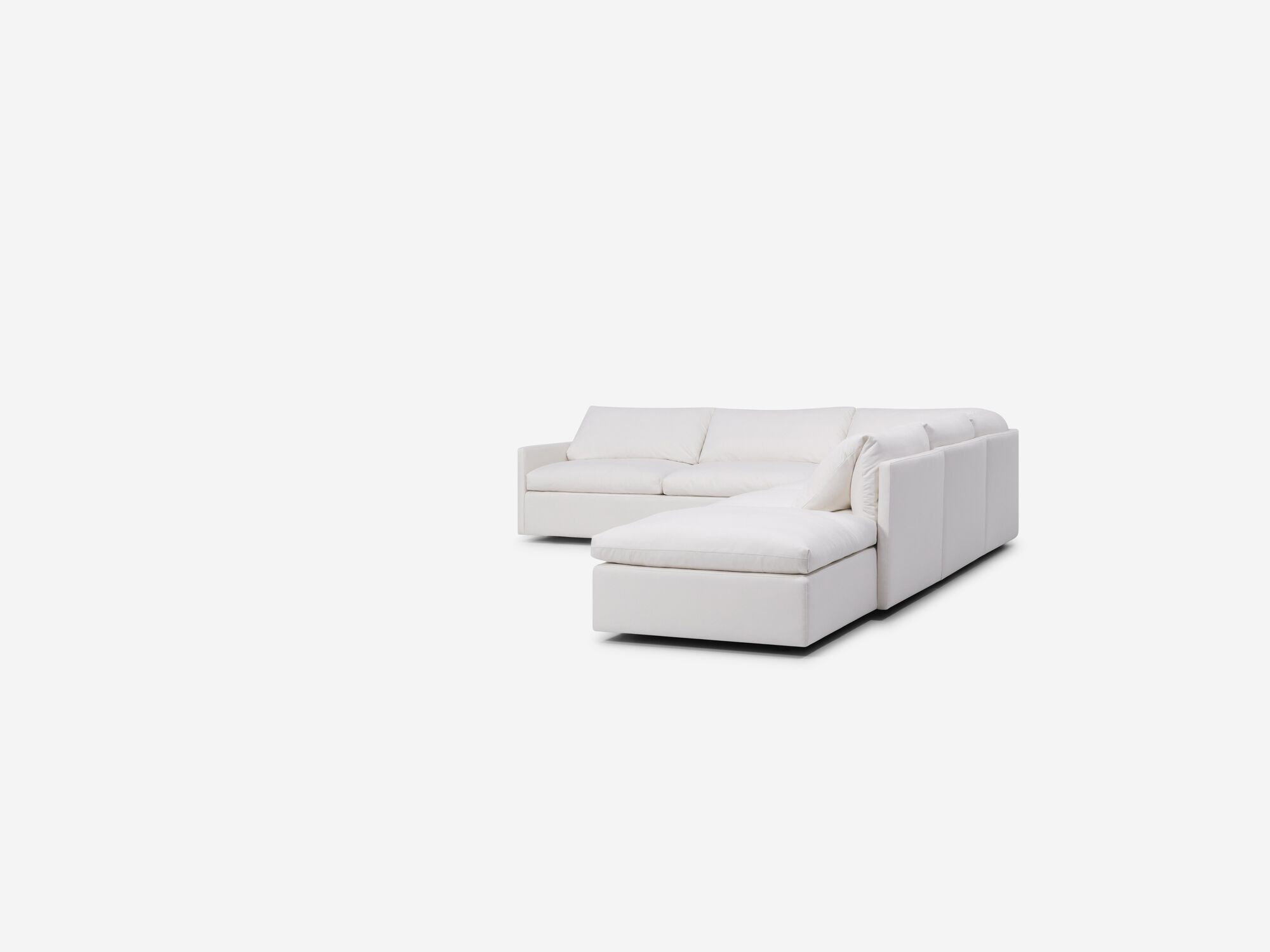 White sectional sofa with narrow arms and right hand chaise right angle view