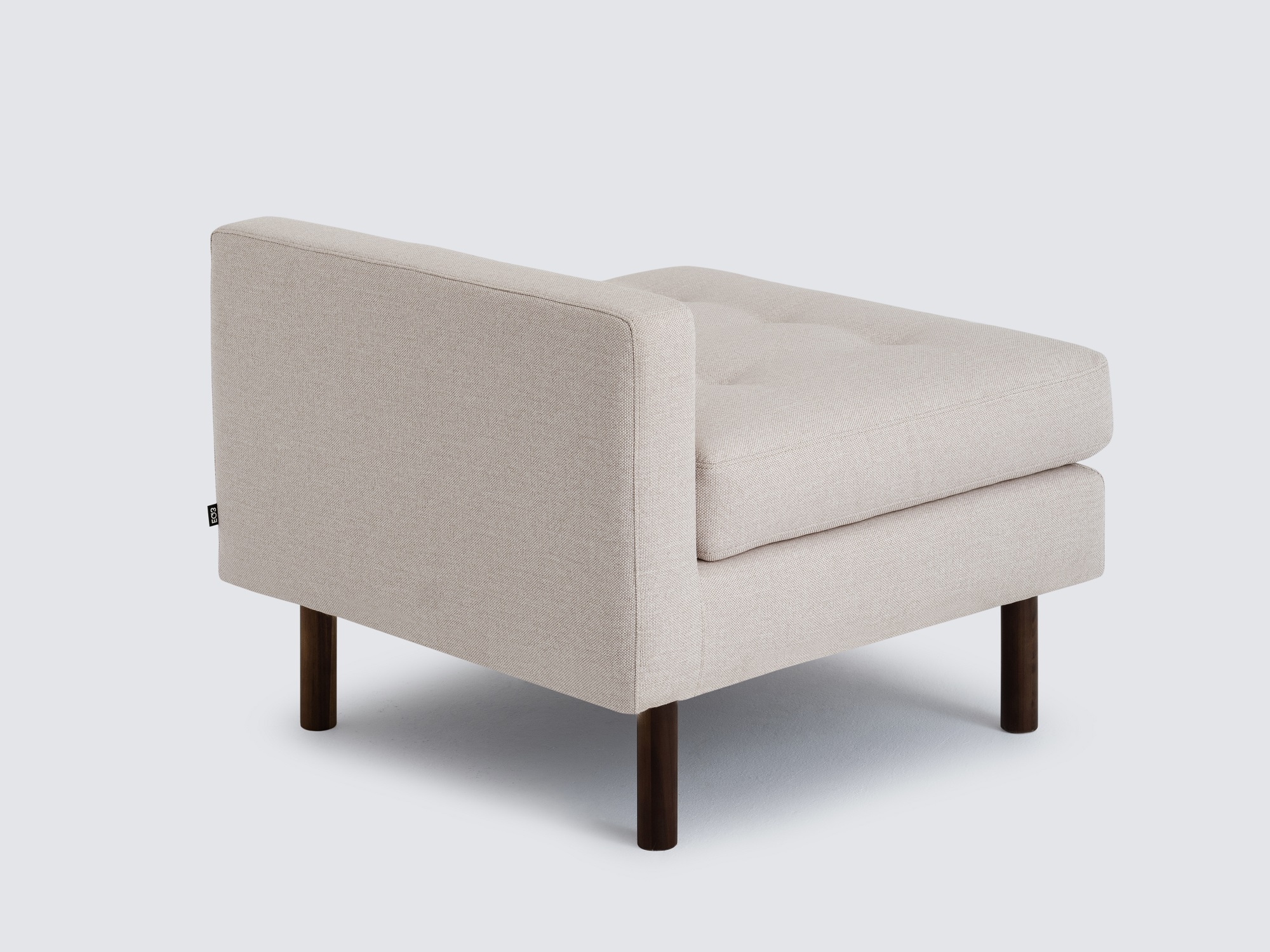 Back detail view of the Joan extended chair upholstered in beige fabric