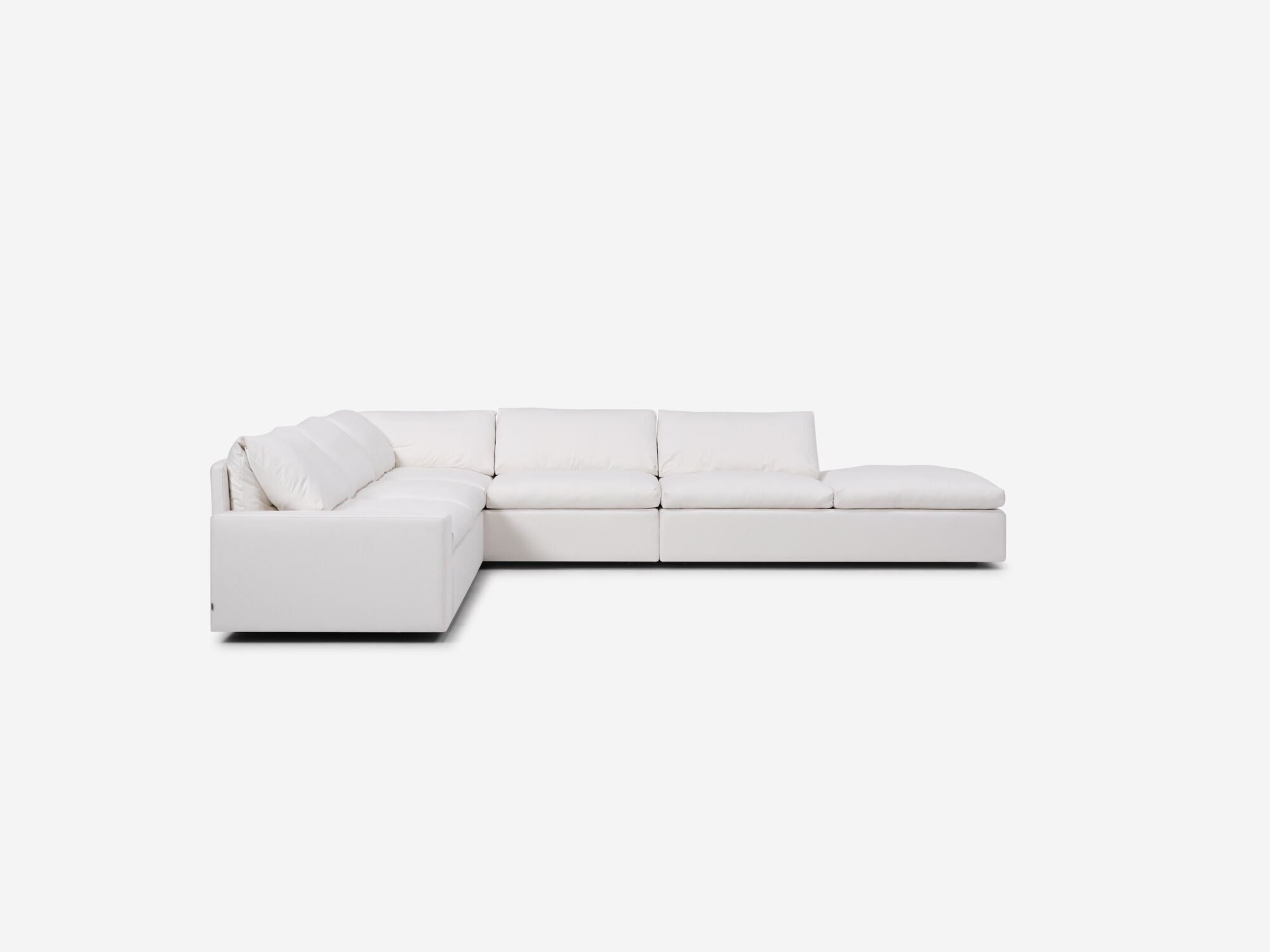 White sectional sofa with right hand chaise and wide arms side view