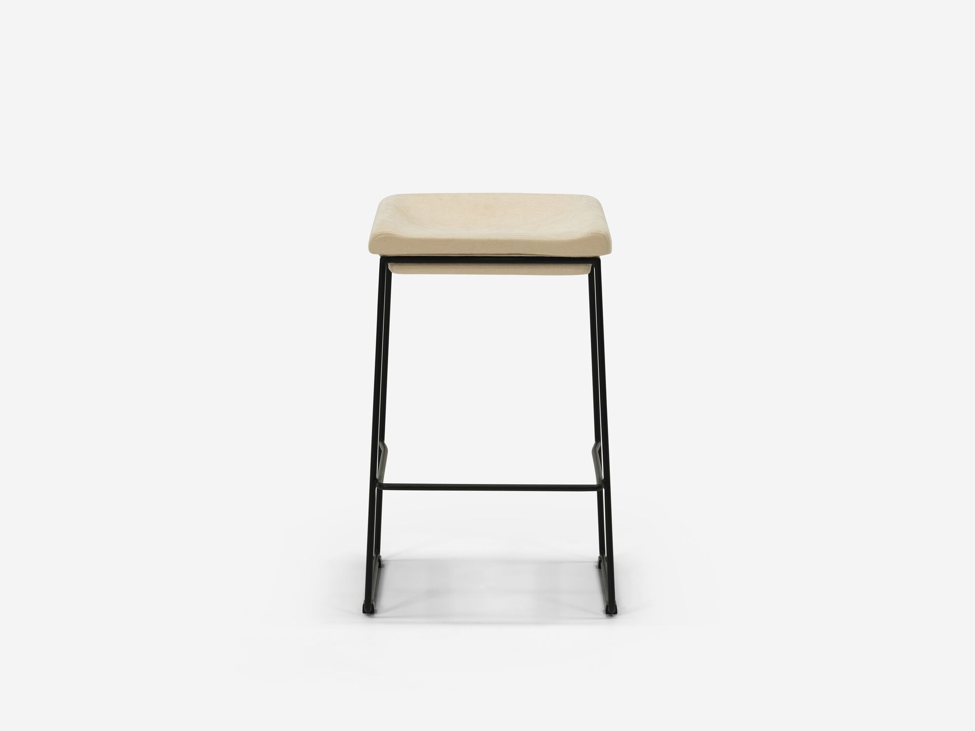 Front view of counter stool with beige seat and black legs