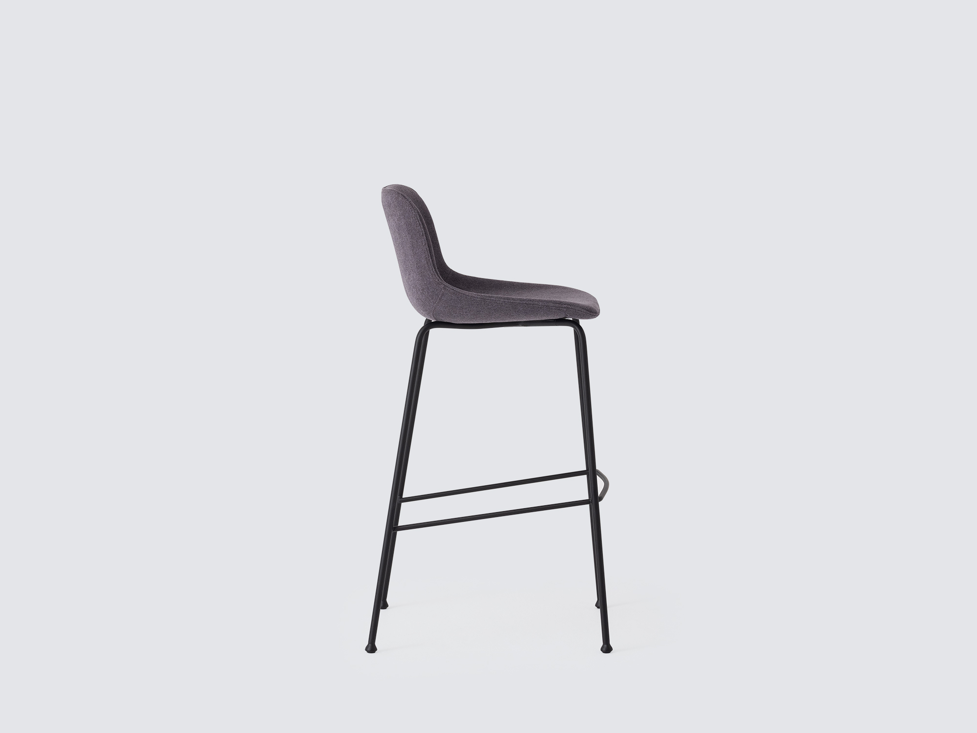 Side view of the Oles counter height bat stool with grey fabric seat