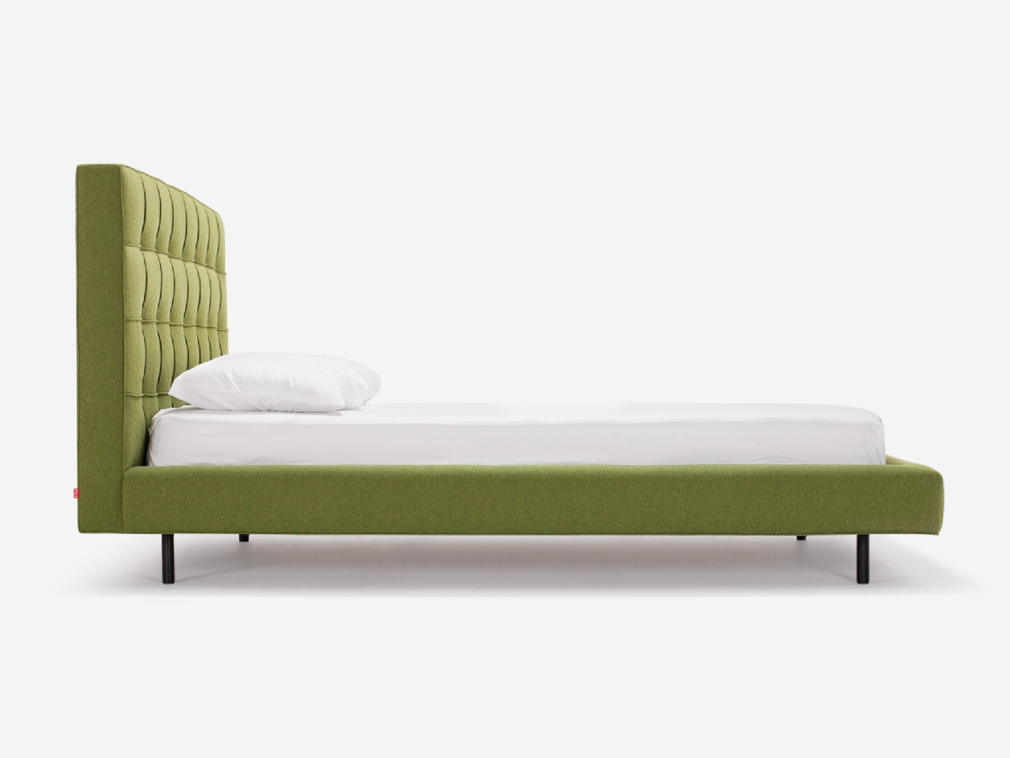 Side view of Winston, the mid century modern bed, in green fabric with a high headboard