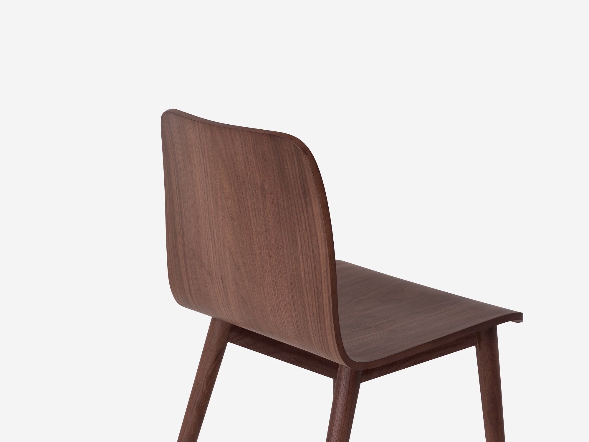 Detail view of the Tami mid century dining chair in walnut