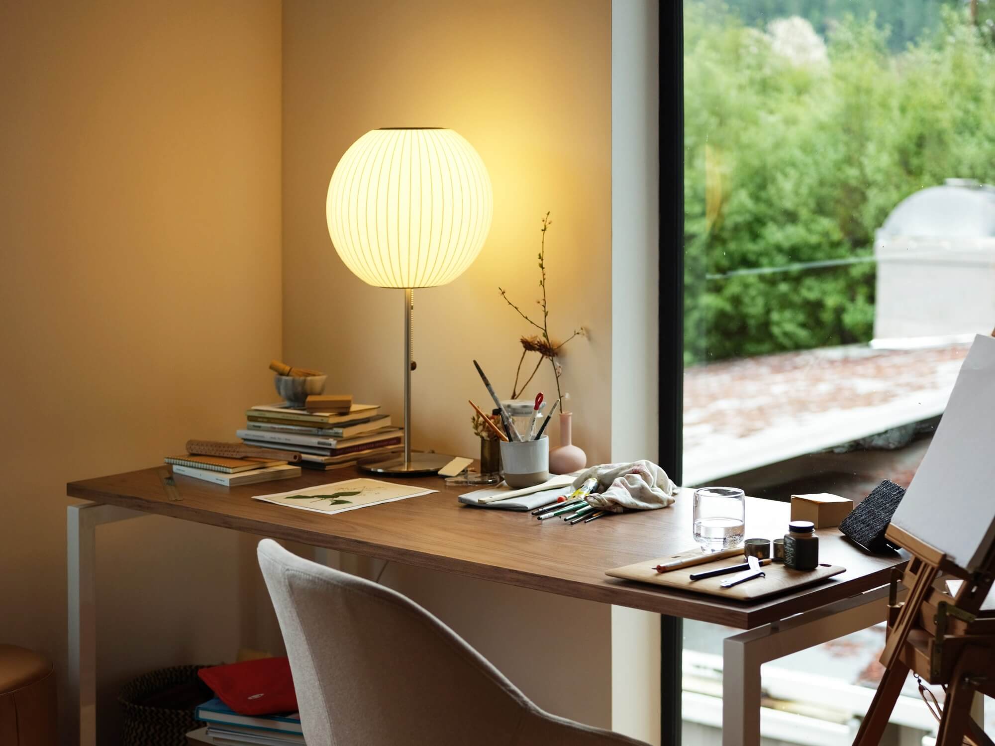 Nelson ball lotus table lamp on desk in modern home office