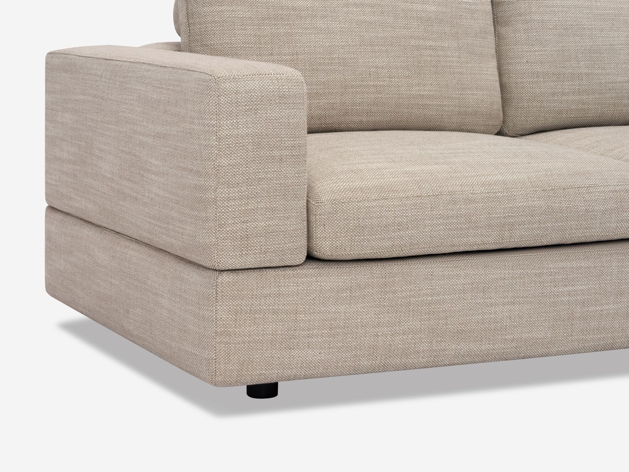 Front leg detail view of modern beige sofa