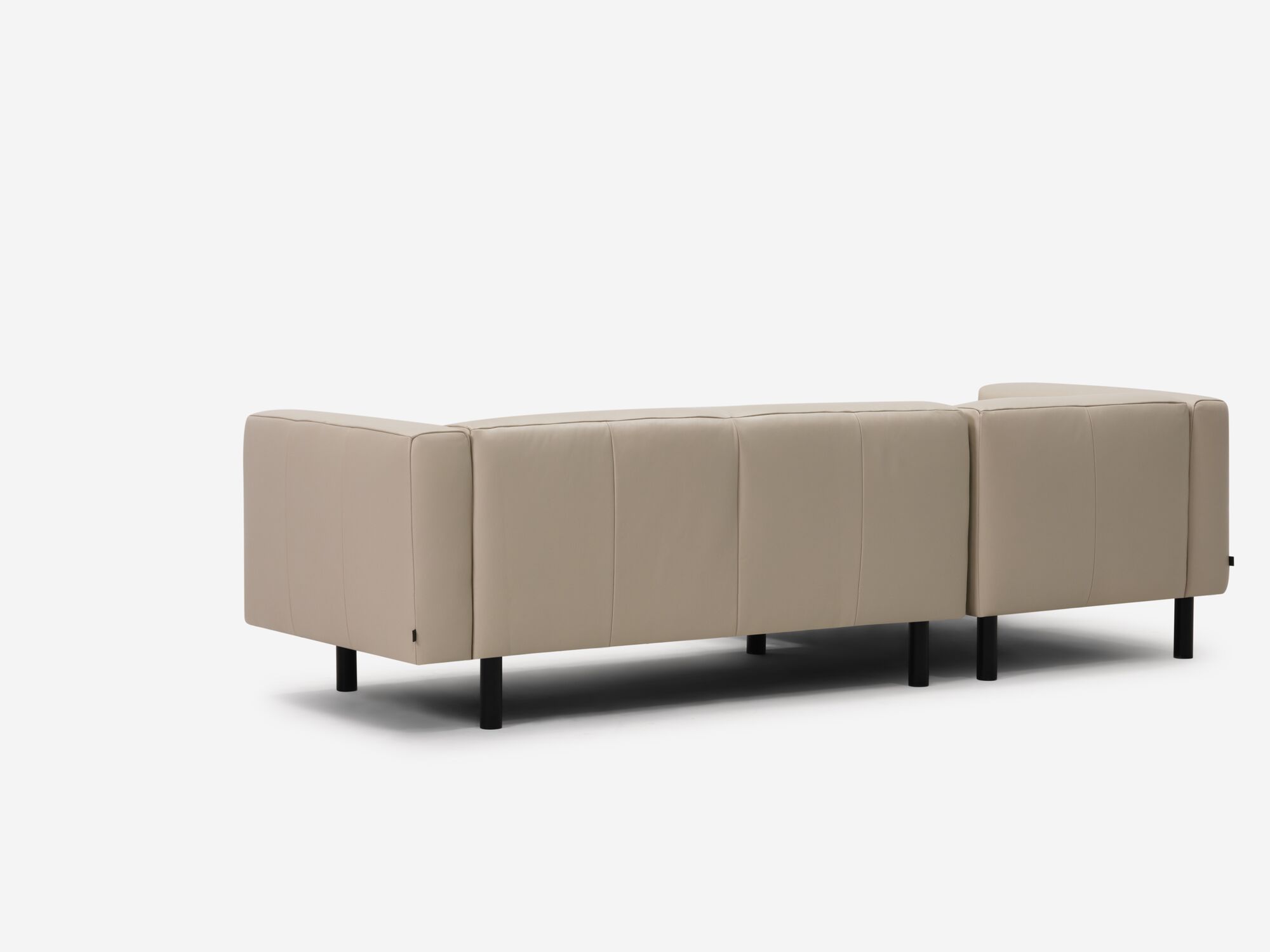 Beige leather sectional left back angle view