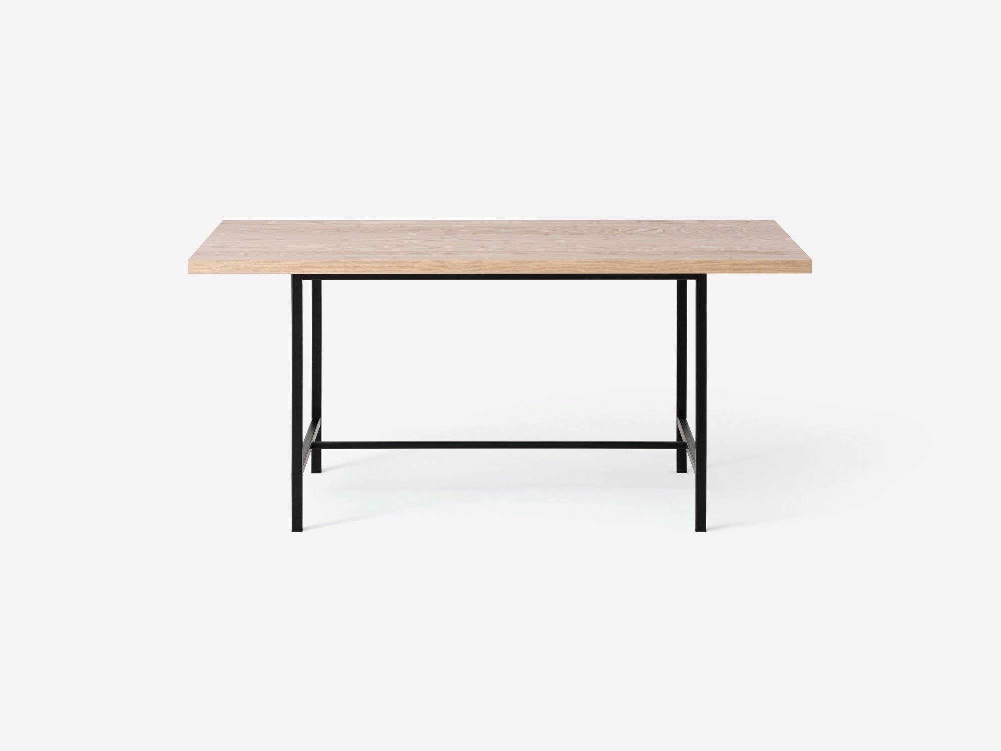 Front view of the Kendall 66" modern dining table with solid oak top and black base