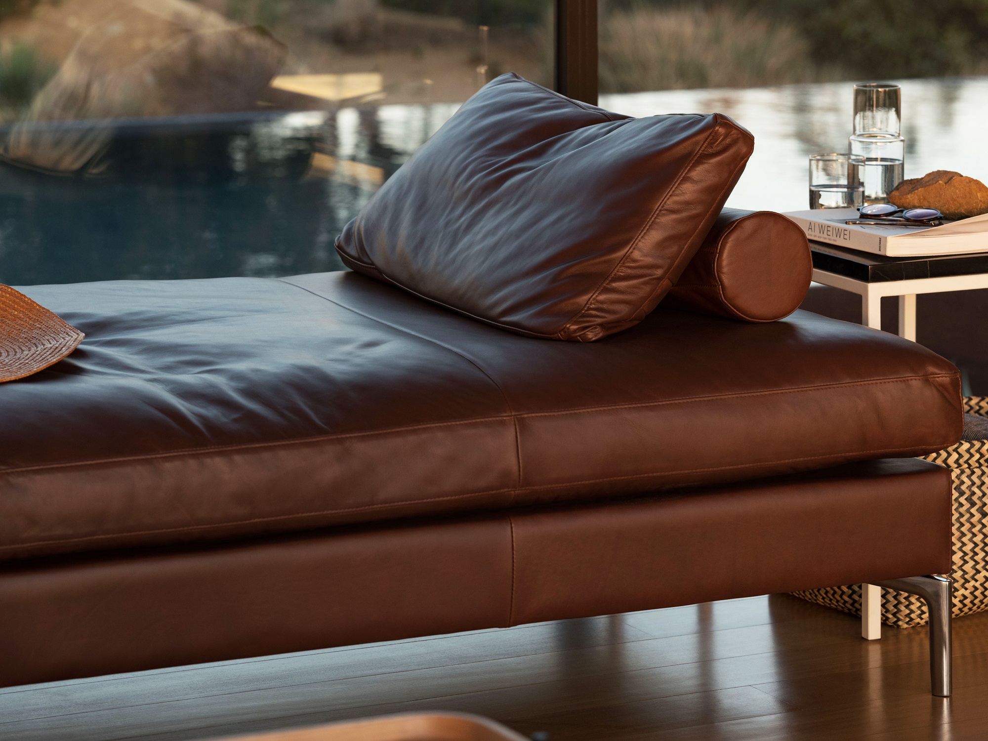 leather day bed with two pillows